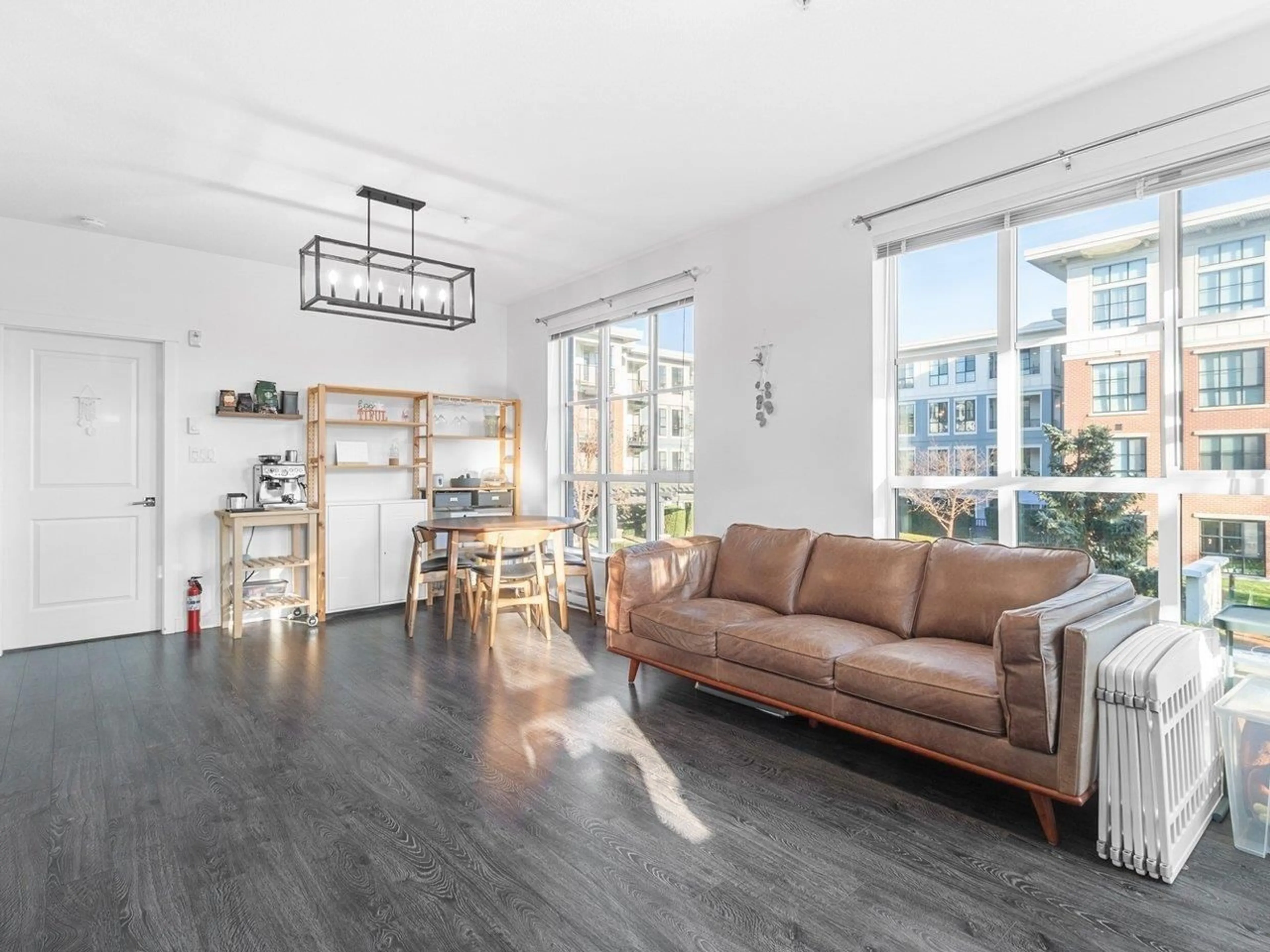 Living room with furniture, wood/laminate floor for 207 - 15168 33, Surrey British Columbia V3Z0N7