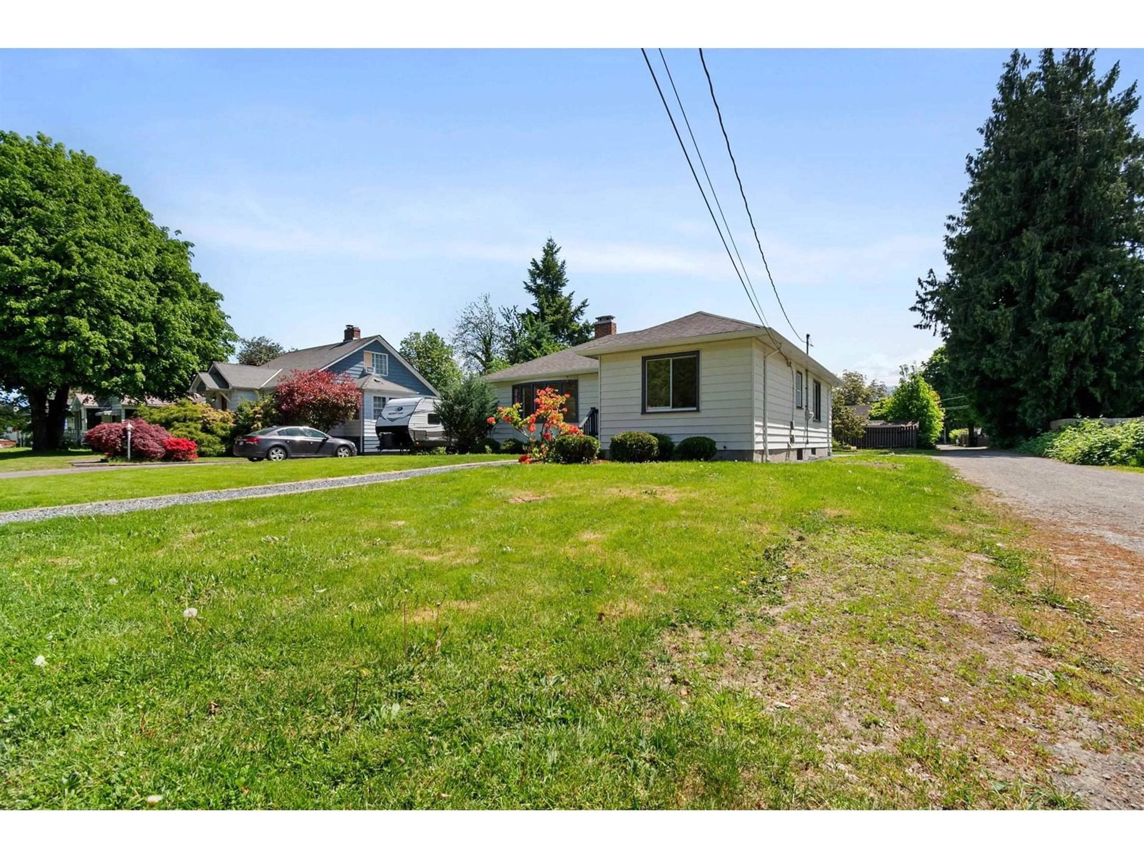A pic from outside/outdoor area/front of a property/back of a property/a pic from drone, street for 46124 MELLARD AVENUE, Chilliwack British Columbia V2P2Y9