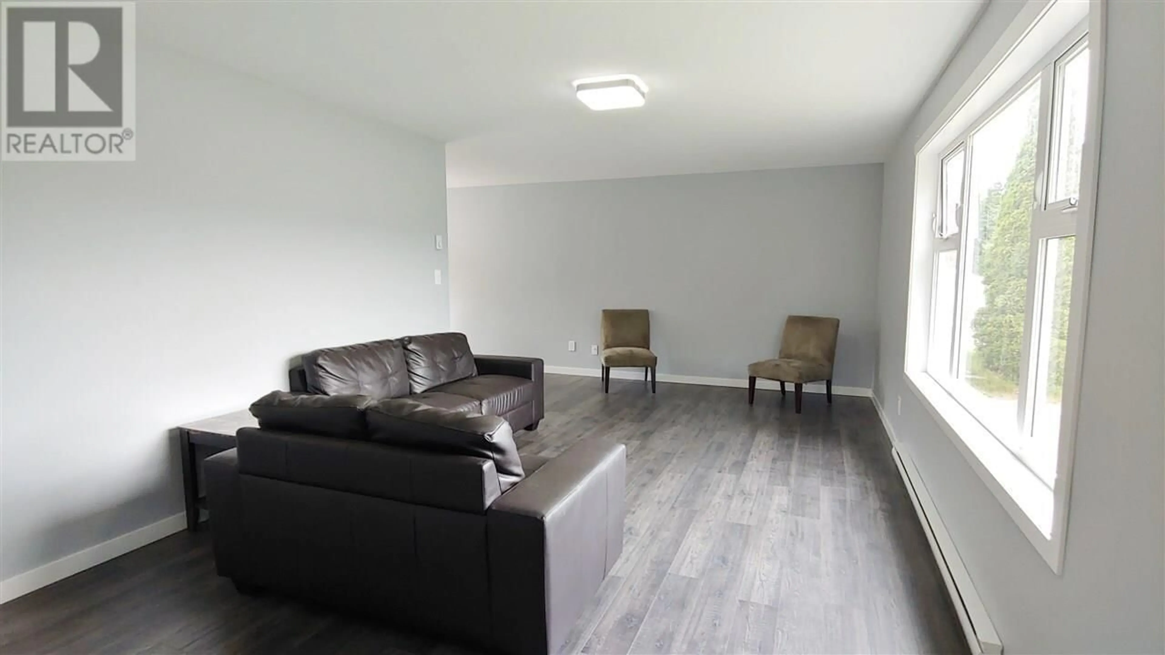 Living room with furniture, wood/laminate floor for 135 BAXTER AVENUE, Kitimat British Columbia V8C2P2