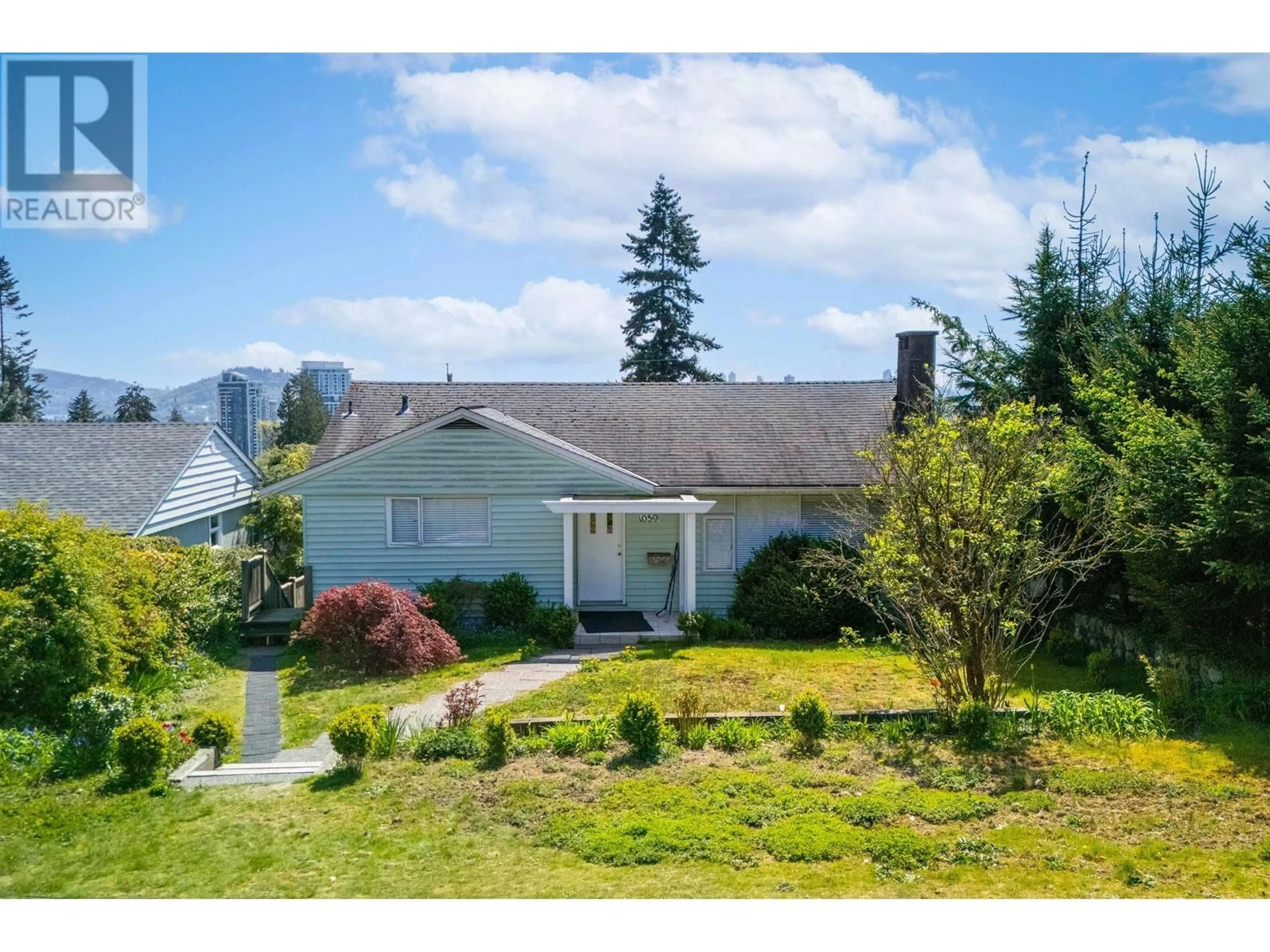 A pic from outside/outdoor area/front of a property/back of a property/a pic from drone, mountain view for 1059 CALVERHALL STREET, North Vancouver British Columbia V7L1Y4