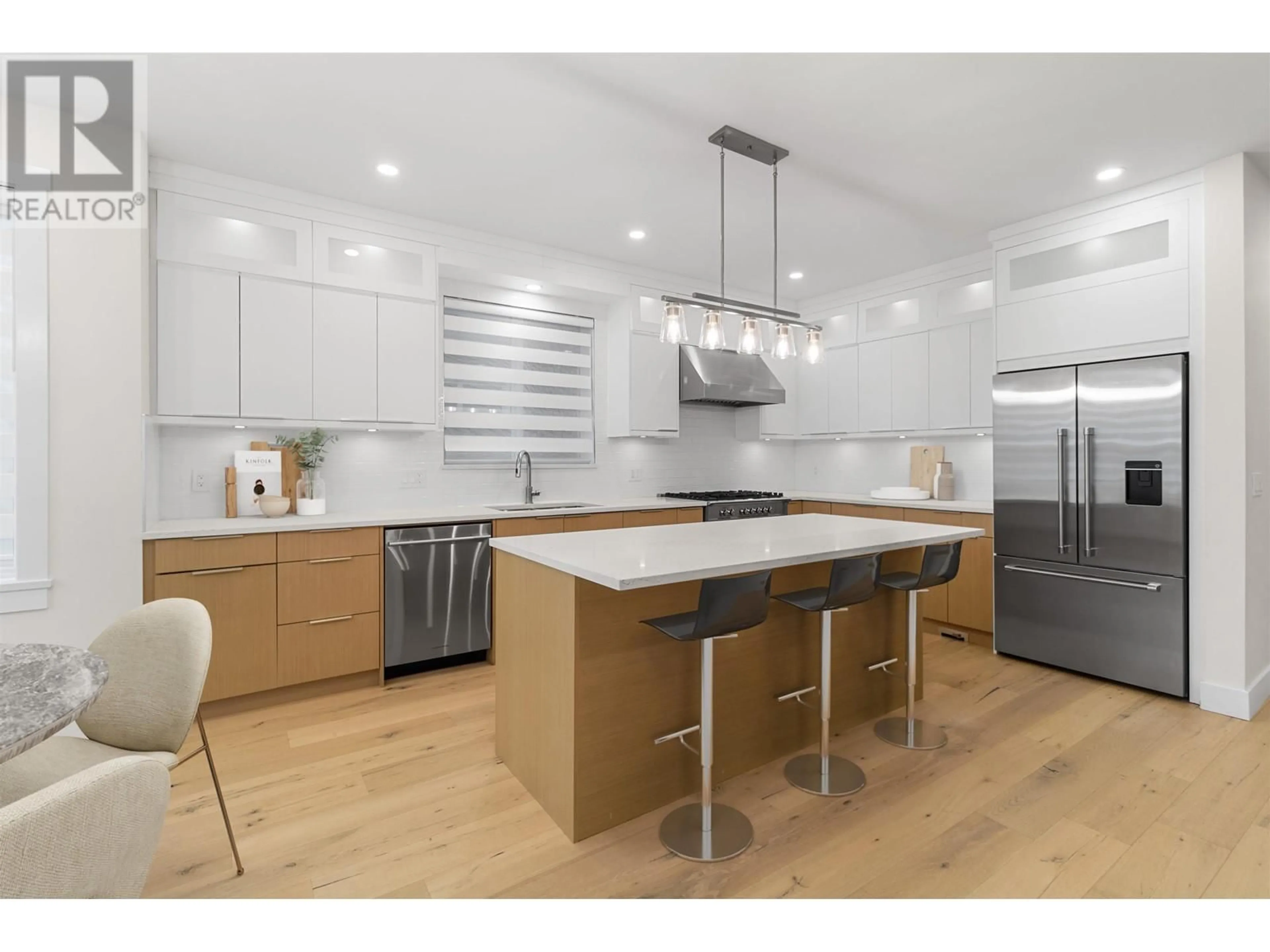 Open concept kitchen, wood/laminate floor for 4577 53 STREET, Ladner British Columbia V4K2Y9