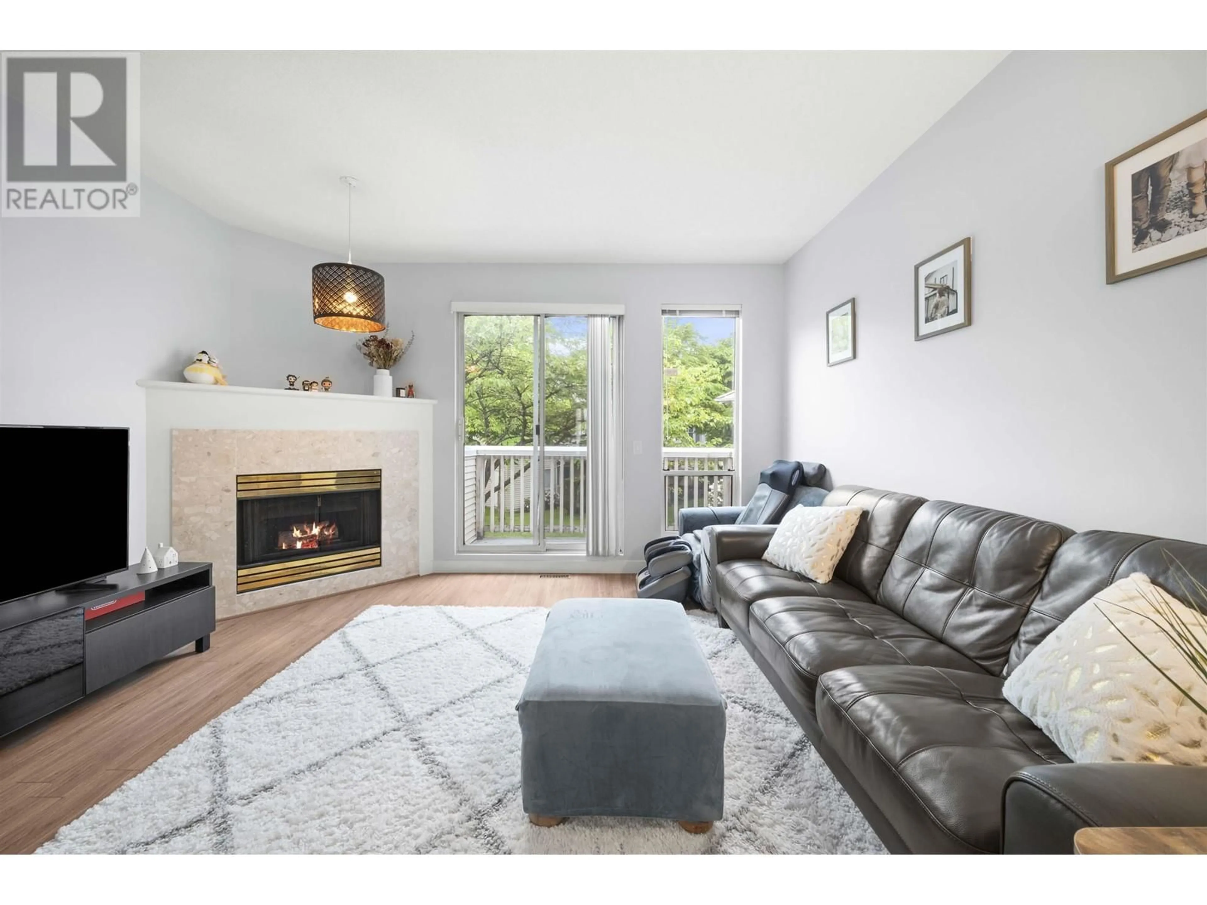 Living room with furniture, wood/laminate floor for 7 - 12920 JACK BELL DRIVE, Richmond British Columbia V6V2V9