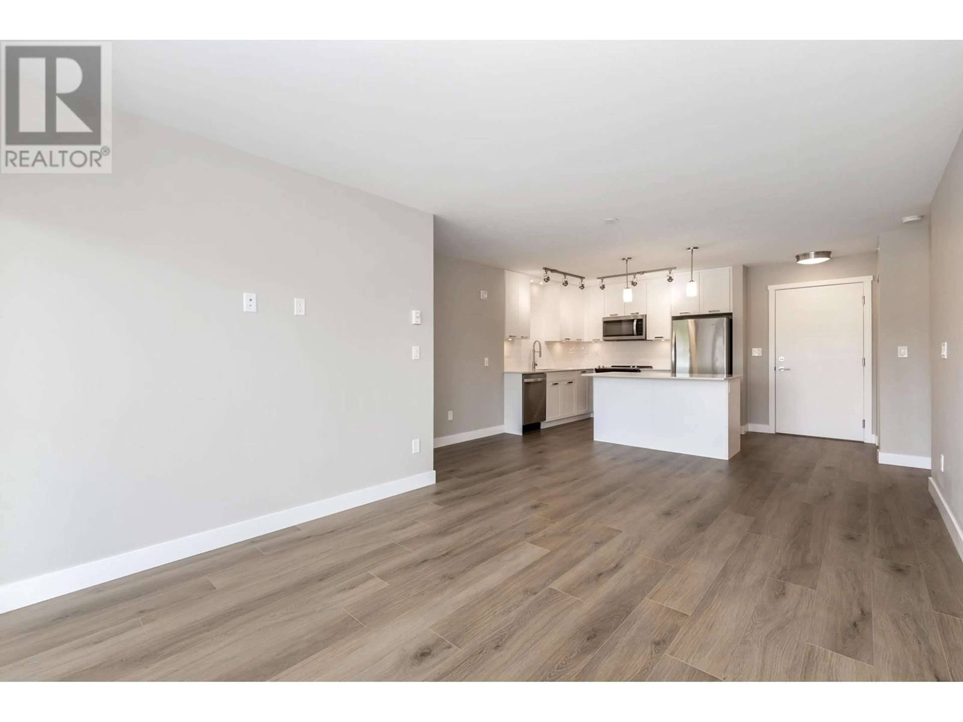 Open concept kitchen, wood/laminate floor for 417 - 22562 121 AVENUE, Maple Ridge British Columbia V2X3Y8