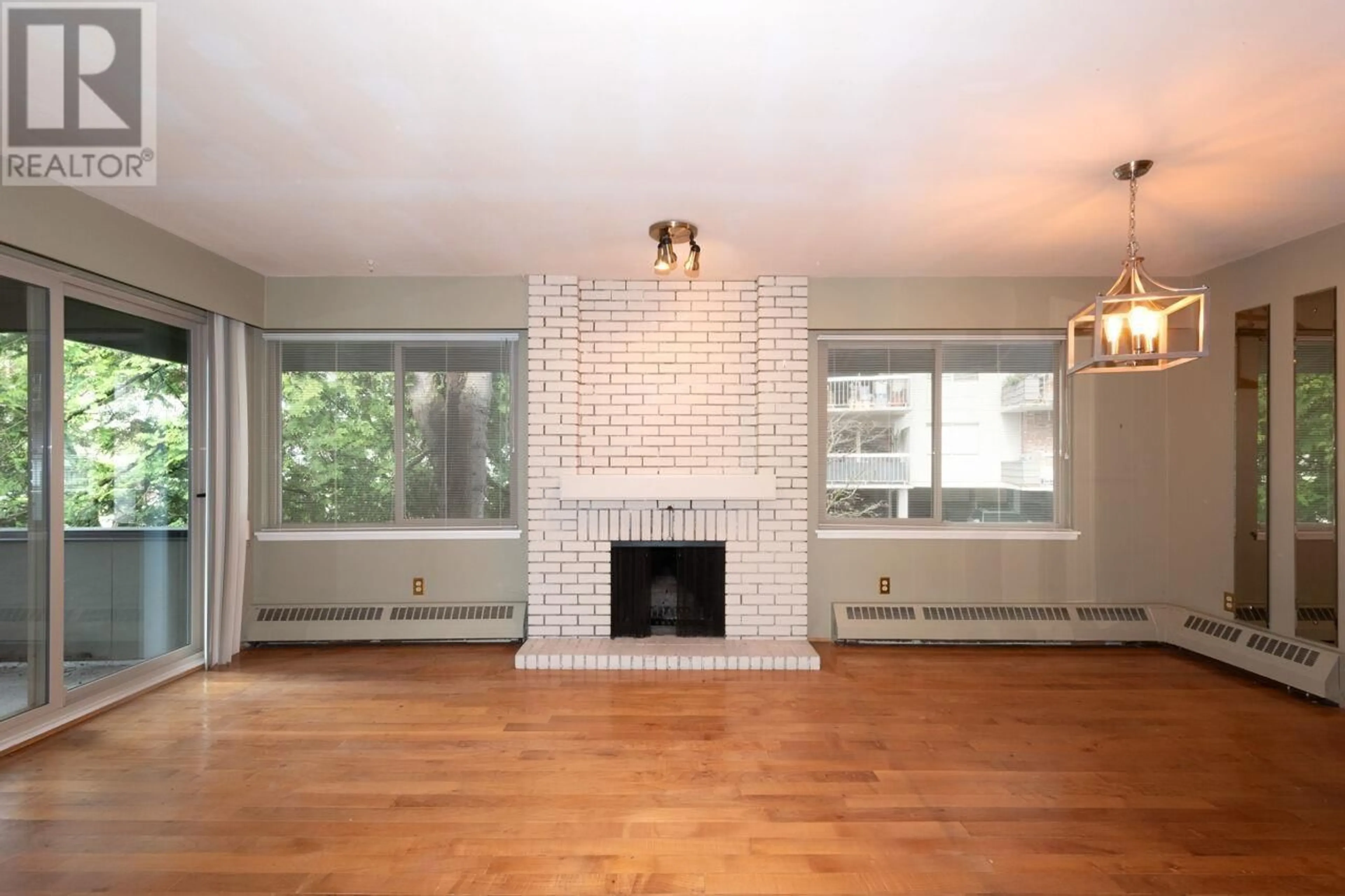 Living room with furniture, wood/laminate floor for 704 - 235 KEITH ROAD, West Vancouver British Columbia V7T1L5