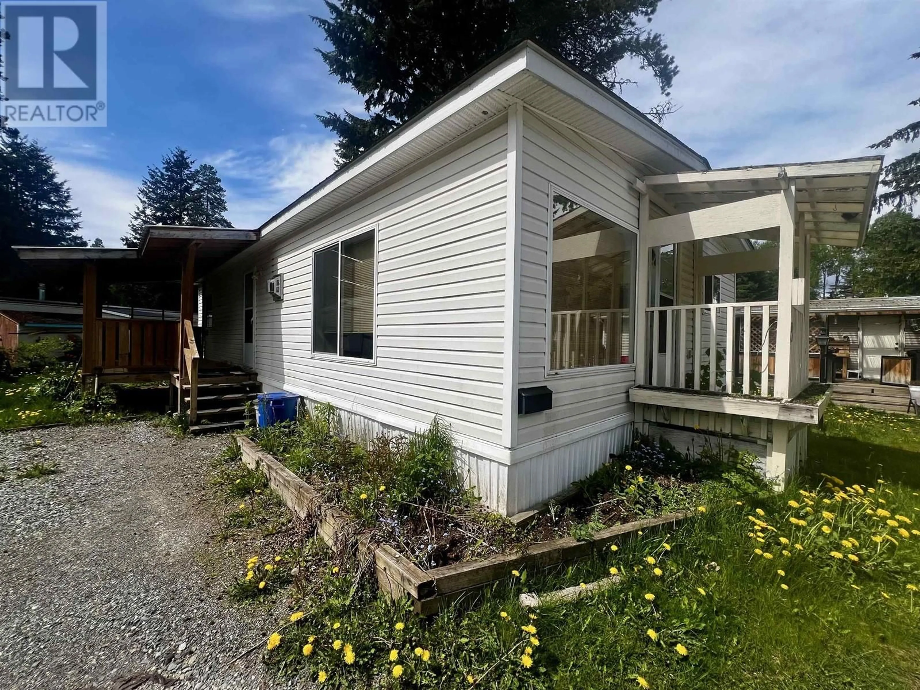 Home with vinyl exterior material, street for 8 - 4619 QUEENSWAY DRIVE, Terrace British Columbia V8G3X5