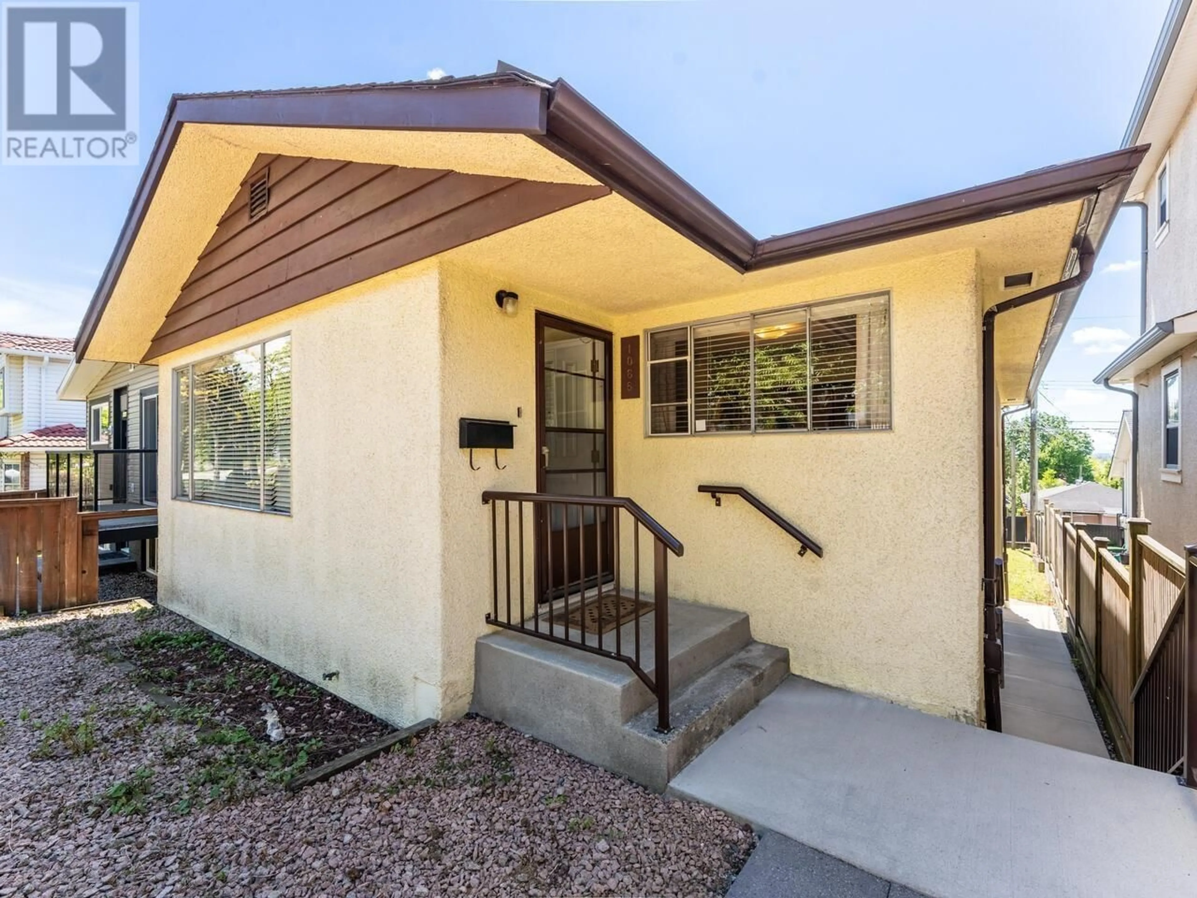 Home with vinyl exterior material, street for 1066 63RD AVENUE, Vancouver British Columbia V5X2L1
