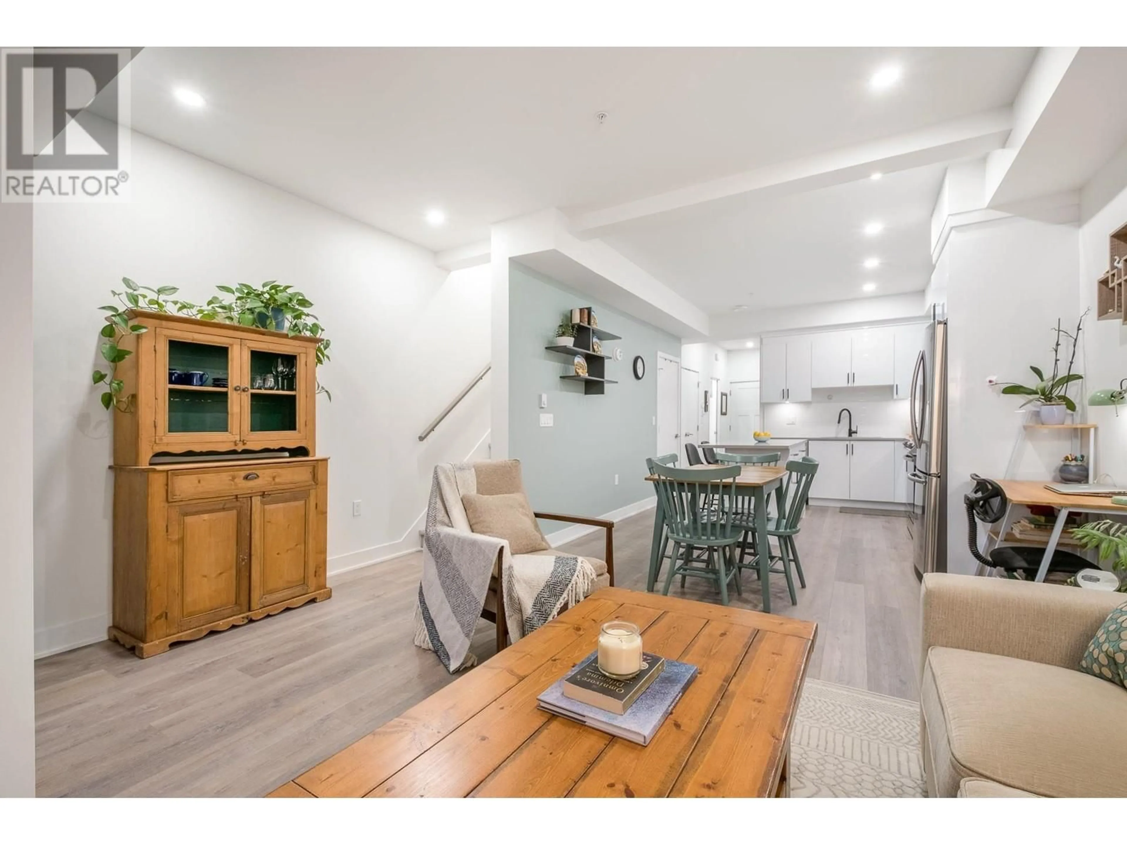 Open concept kitchen, wood/laminate floor for 203 - 37808 THIRD AVENUE, Squamish British Columbia V8B1B9