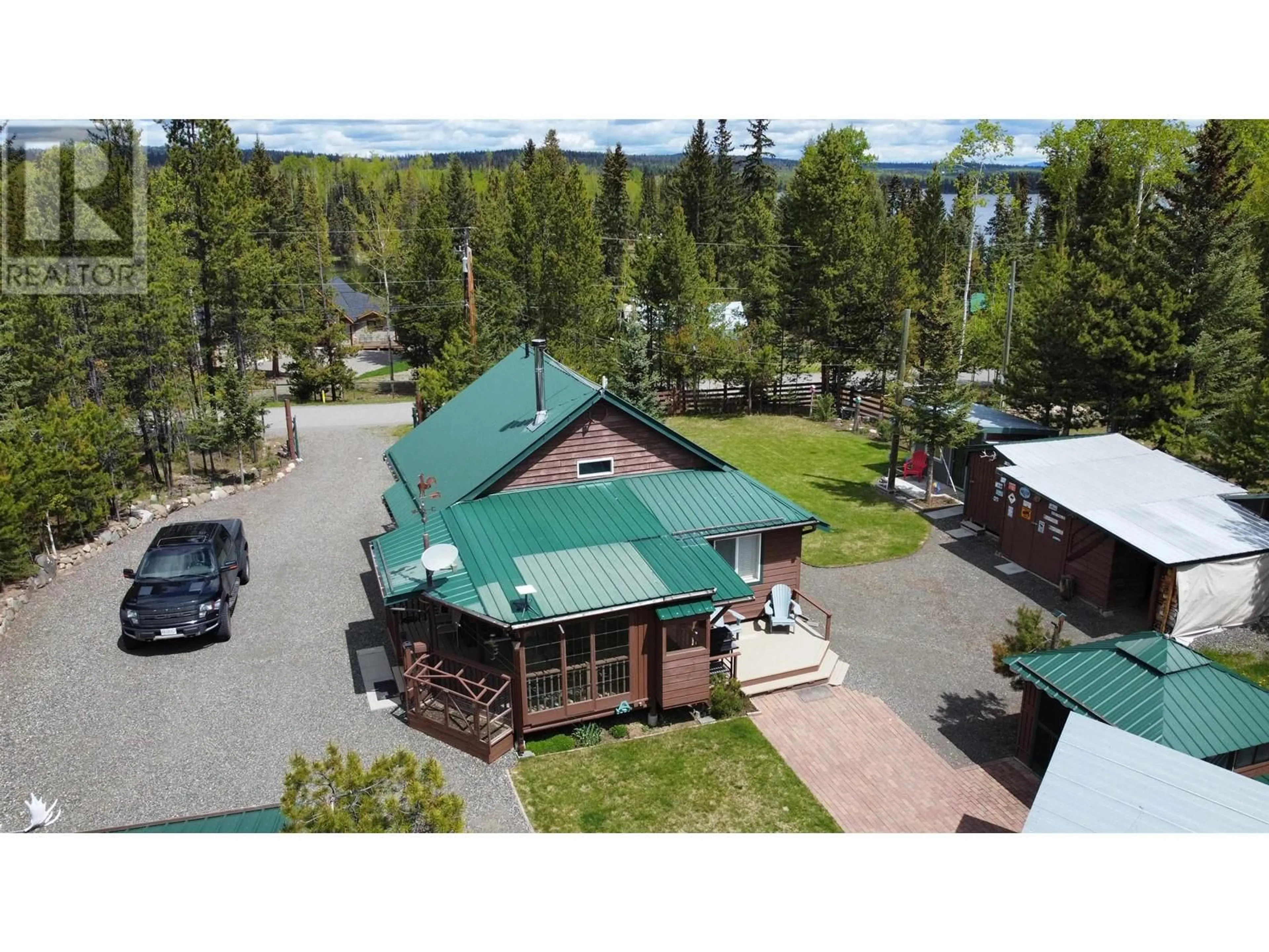 A pic from outside/outdoor area/front of a property/back of a property/a pic from drone, mountain view for 6308 MOOSE POINT DRIVE, 70 Mile House British Columbia V0K2K1