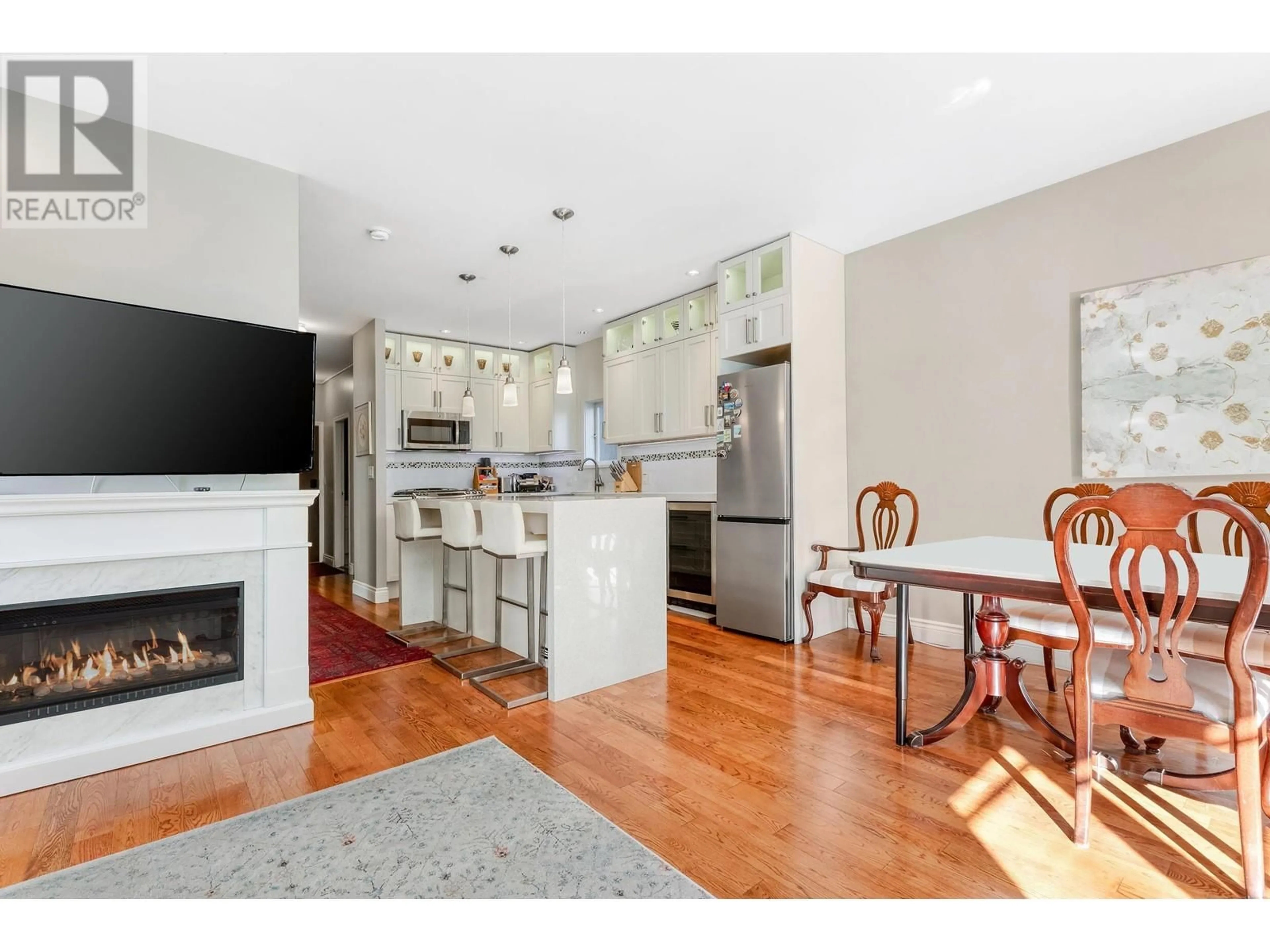 Open concept kitchen, wood/laminate floor for 2814 3RD AVENUE, Vancouver British Columbia V6K1M7
