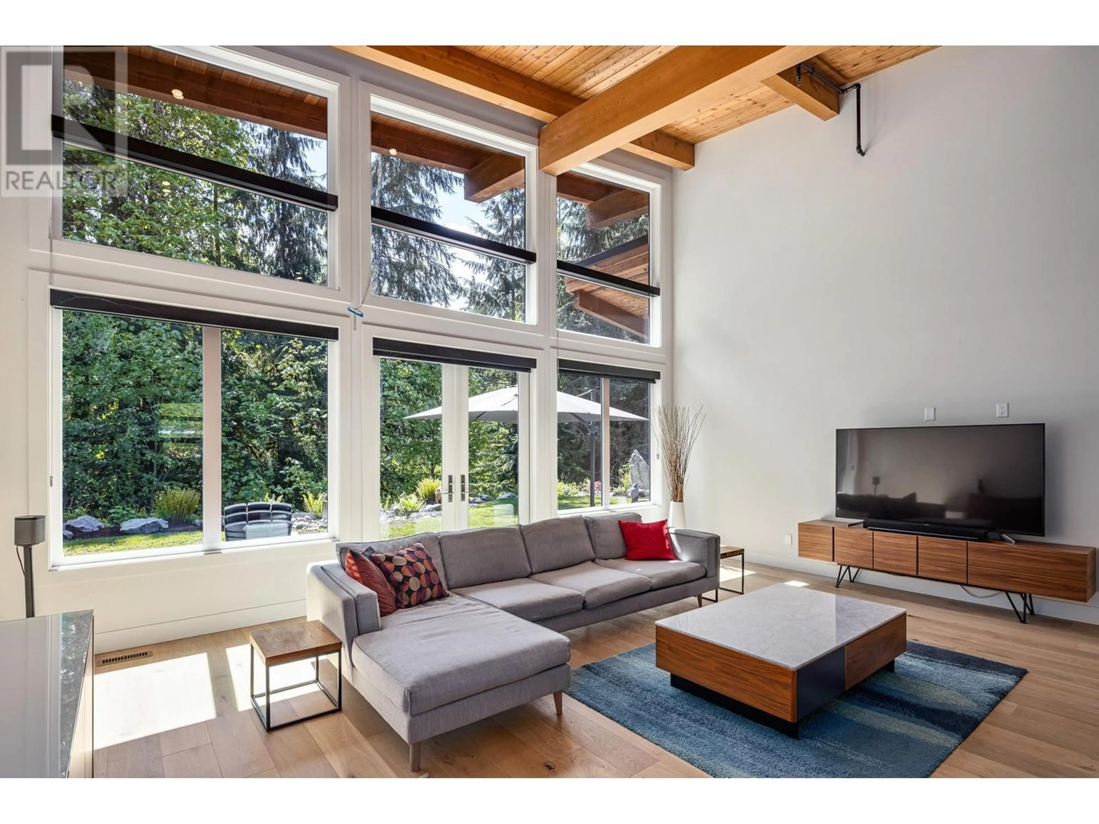 Living room with furniture, wood/laminate floor for 3308 MAMQUAM ROAD, Squamish British Columbia V8B0S6