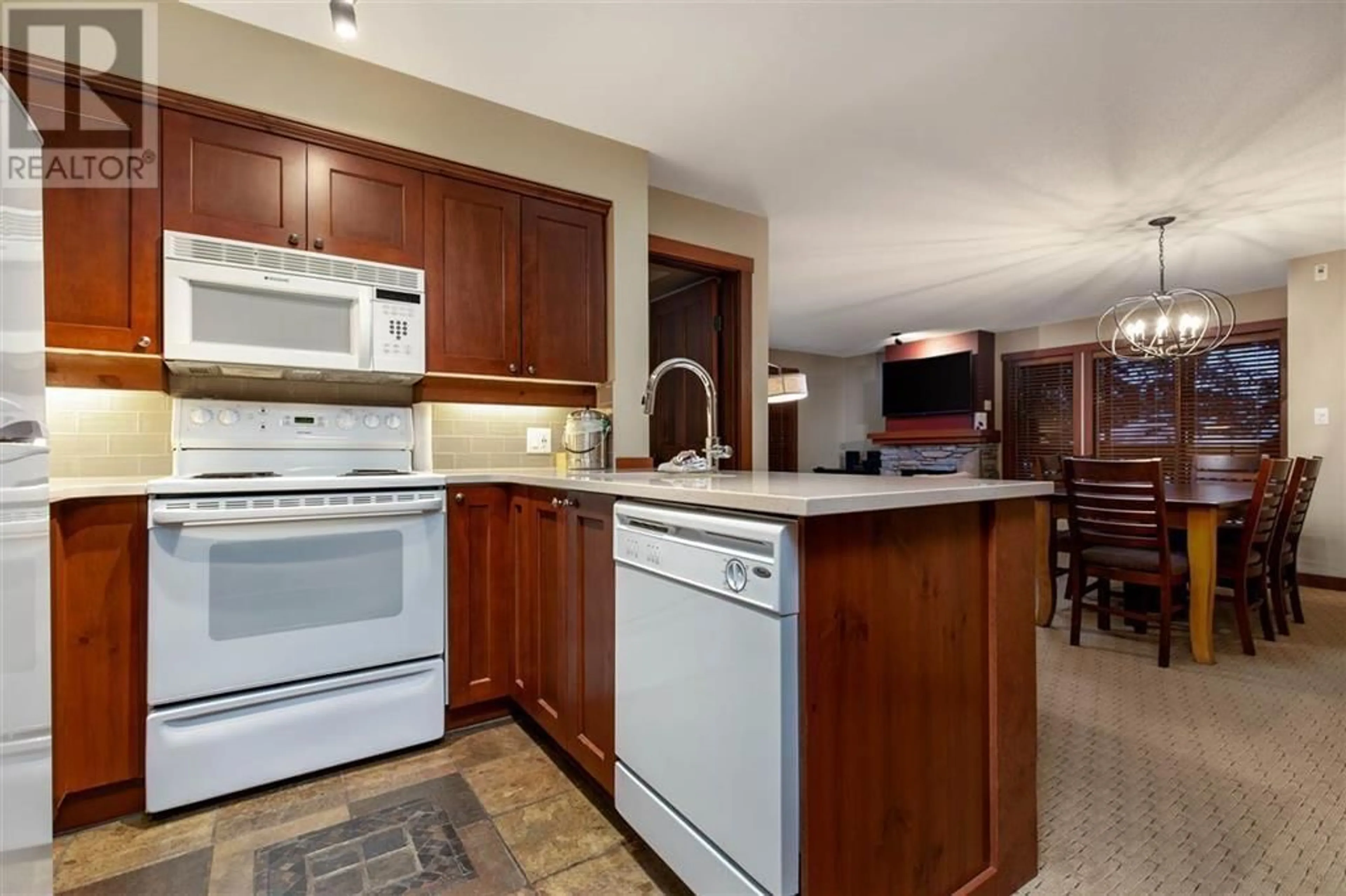 Standard kitchen, ceramic/tile floor for 215 G3 - 4653 BLACKCOMB WAY, Whistler British Columbia V8E0Y9