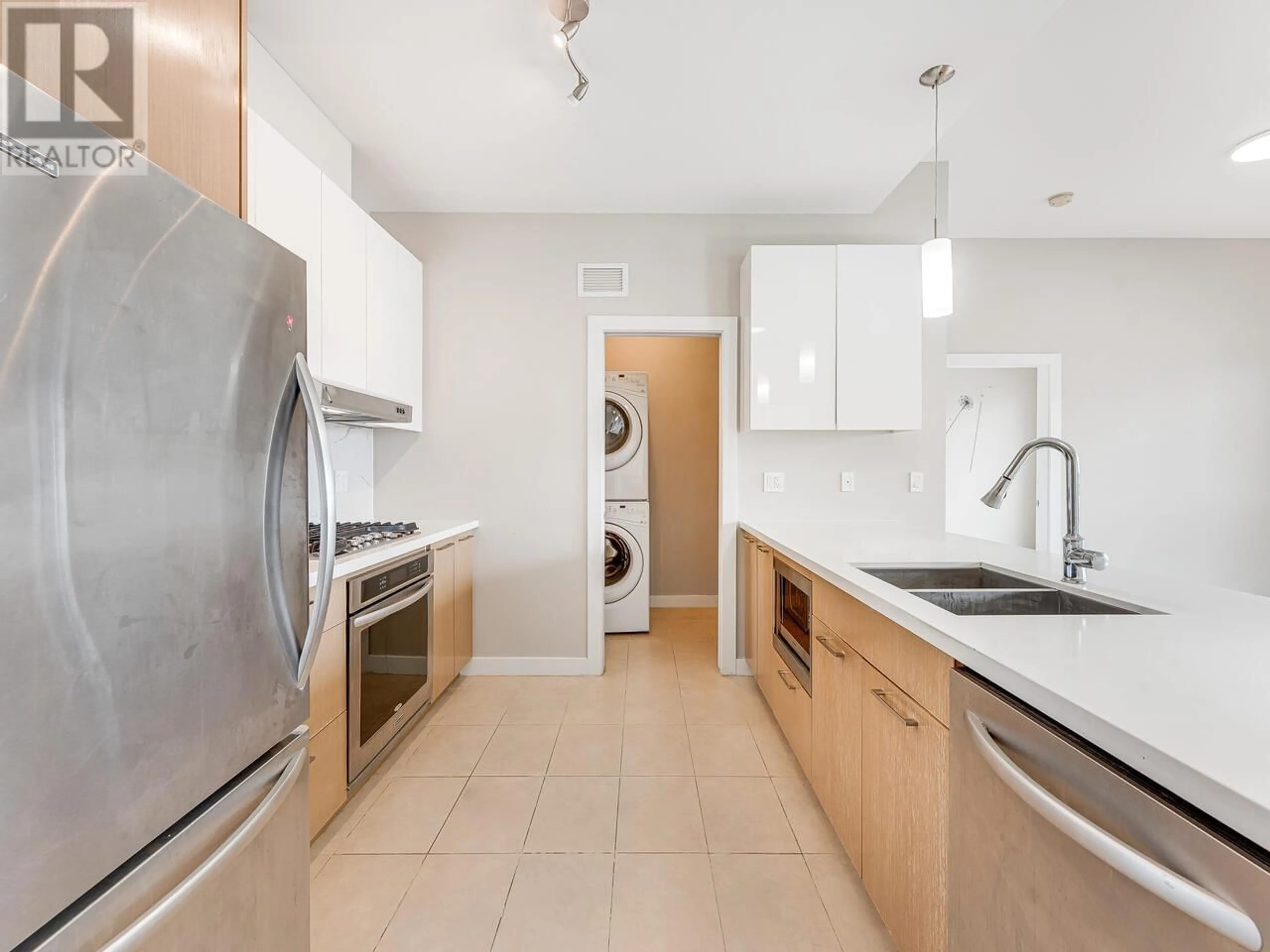 Kitchen with laundary machines, ceramic/tile floor for 611 - 5399 CEDARBRIDGE WAY, Richmond British Columbia V6X0L6