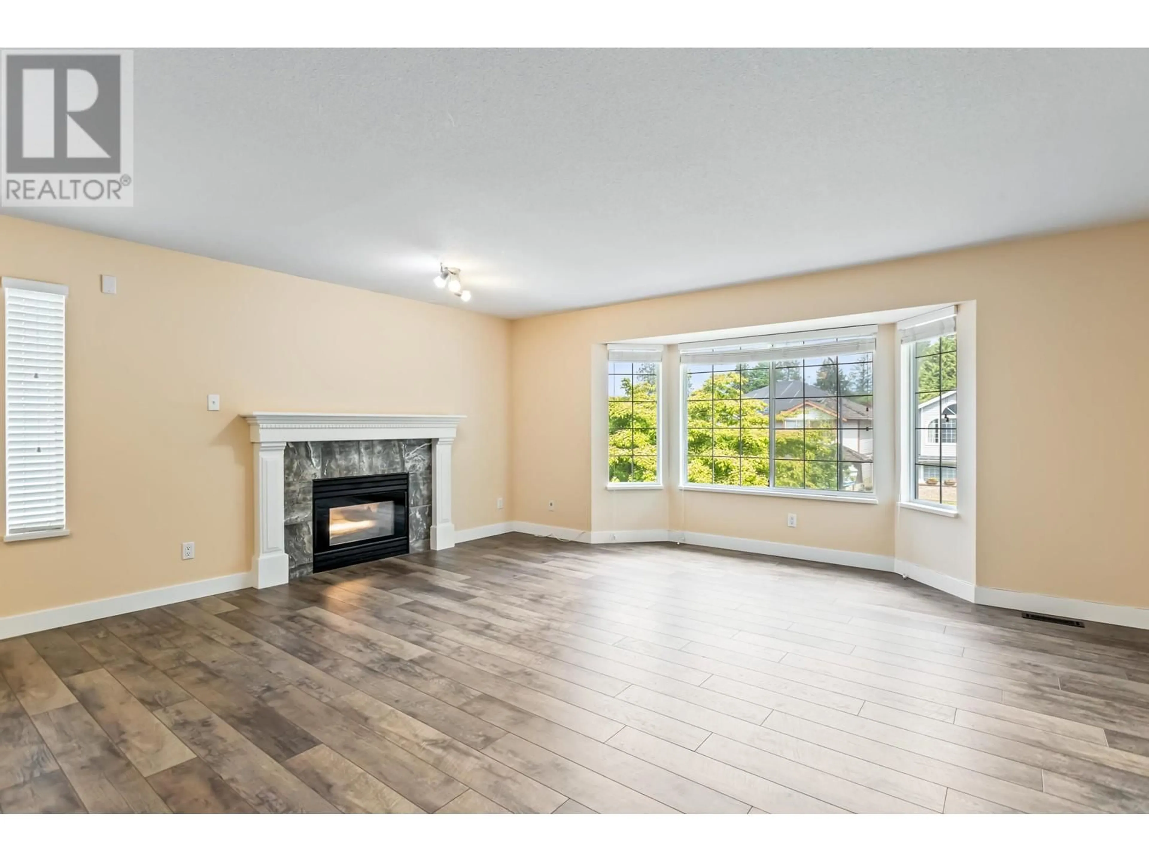 Living room with furniture, wood/laminate floor for 20448 122B AVENUE, Maple Ridge British Columbia V2X1B6