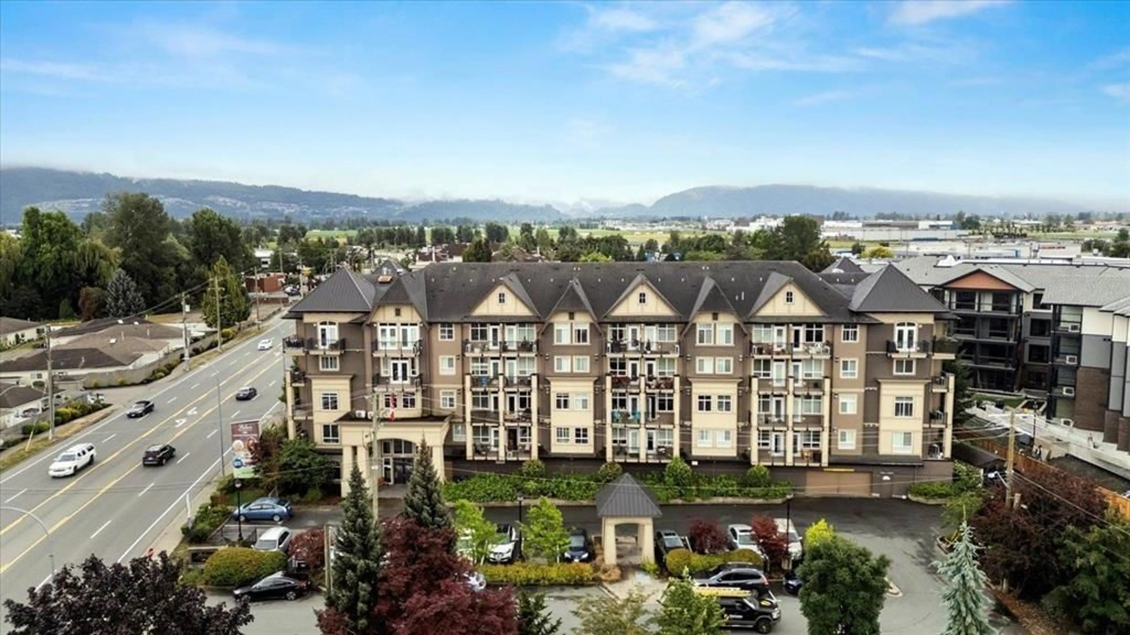 A pic from outside/outdoor area/front of a property/back of a property/a pic from drone, mountain view for 317 - 8531 YOUNG ROAD, Chilliwack British Columbia V2P0E1