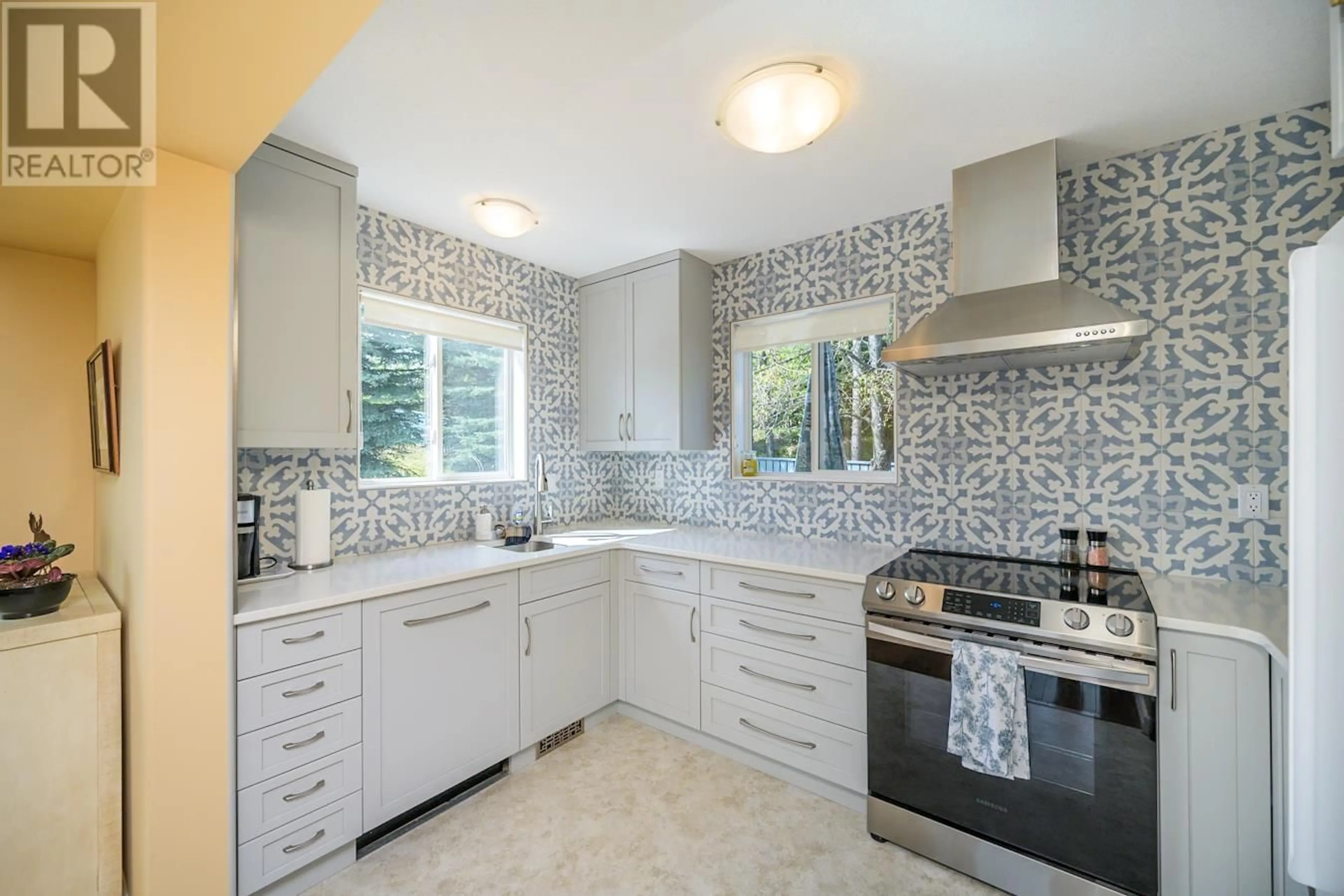 Contemporary kitchen, ceramic/tile floor for 101 - 4281 BAKER ROAD, Prince George British Columbia V2N6M8