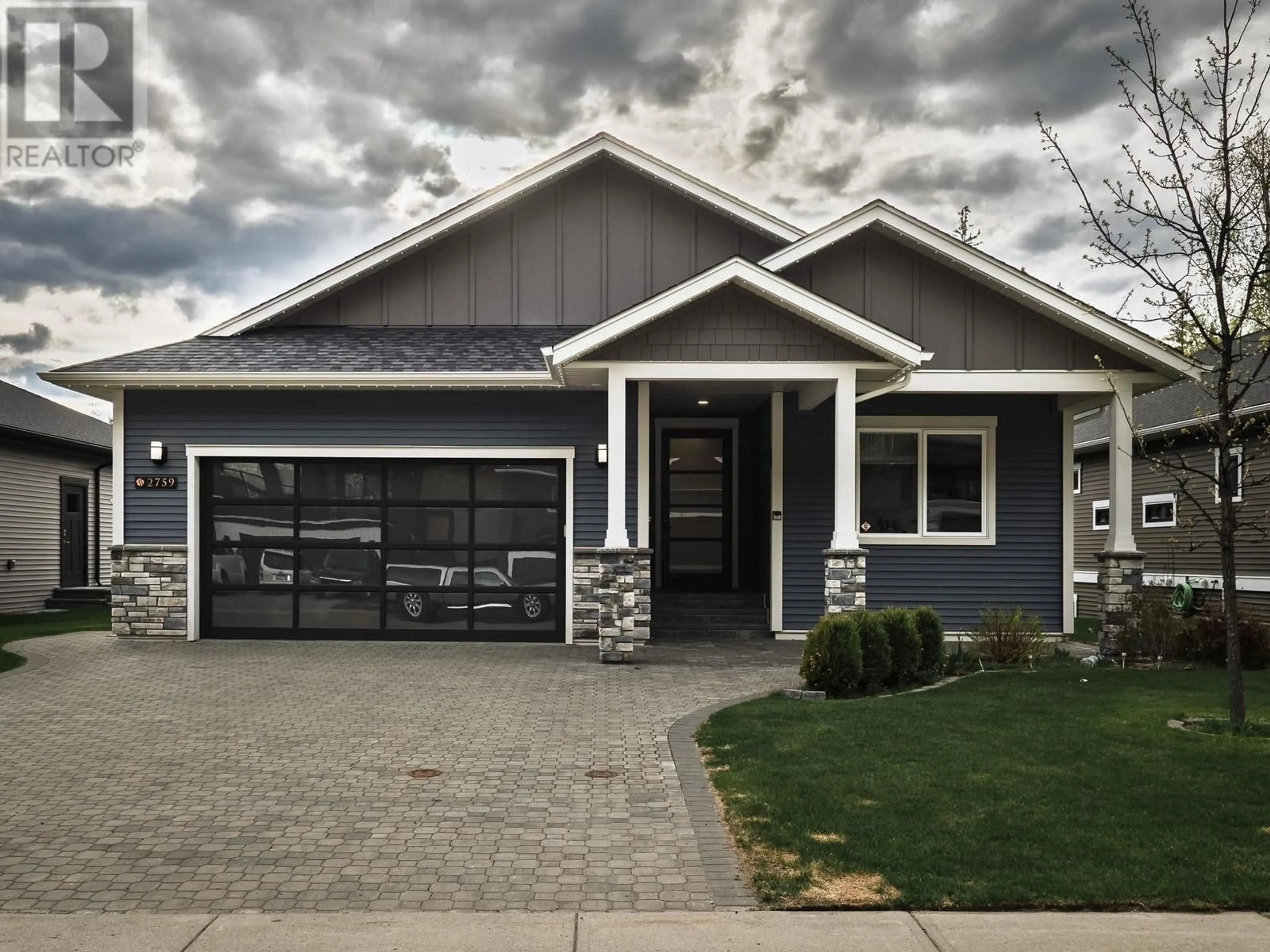 Home with vinyl exterior material, street for 2759 LINKS DRIVE, Prince George British Columbia V2K0B3