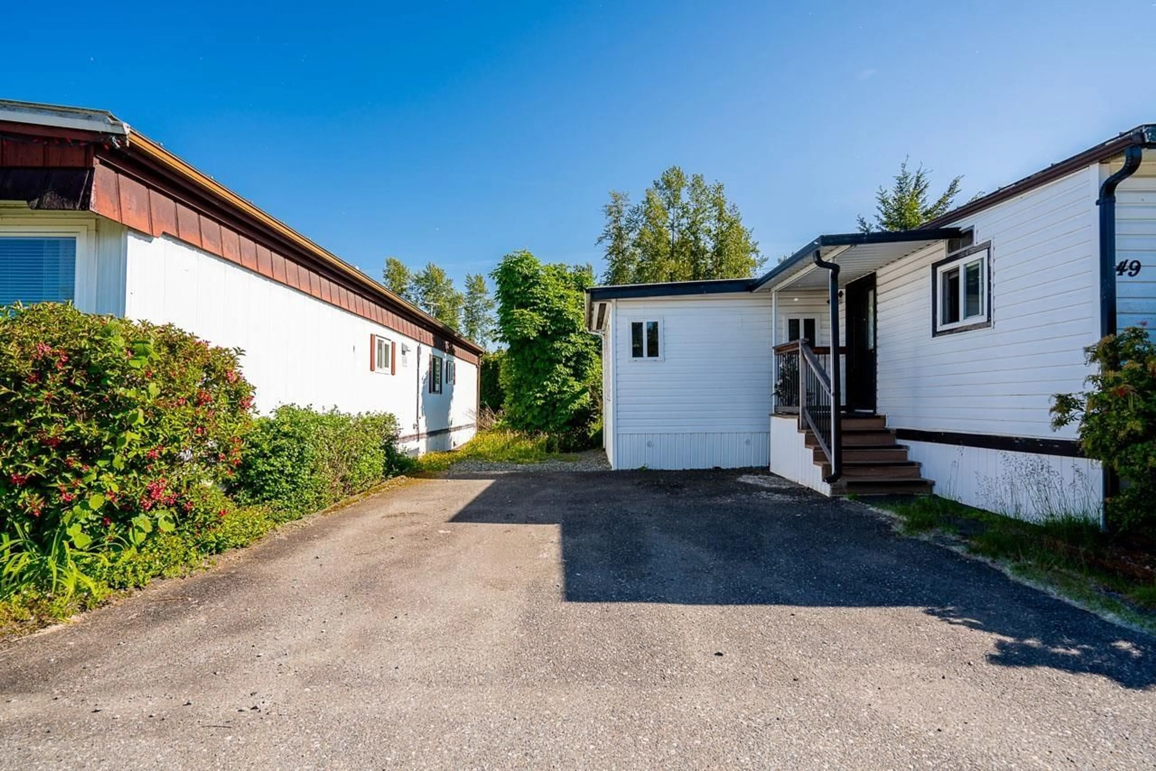 A pic from outside/outdoor area/front of a property/back of a property/a pic from drone, street for 49 - 4426 232, Langley British Columbia V2Z2R3