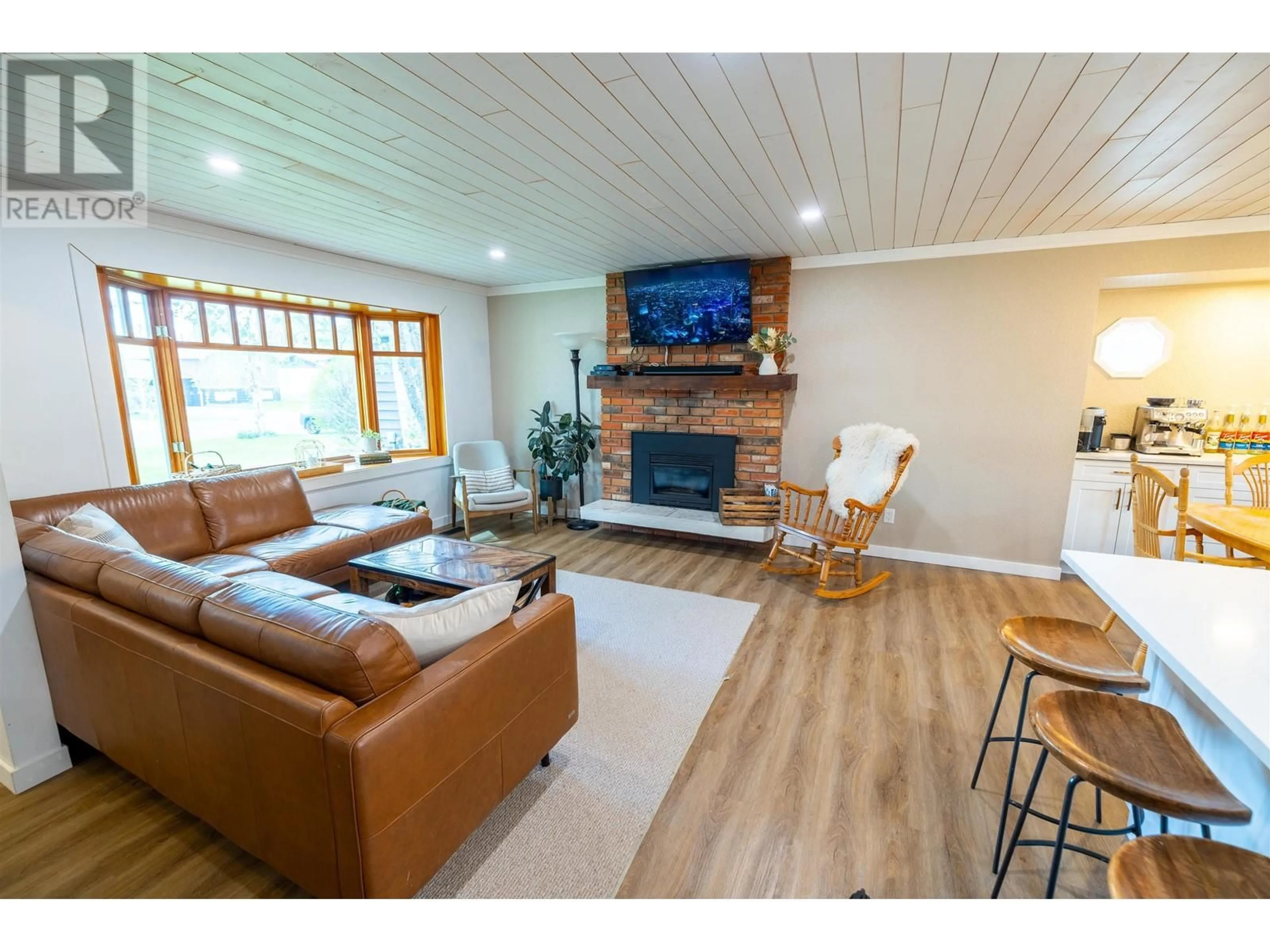 Living room with furniture, wood/laminate floor for 7720 LANCASTER CRESCENT, Prince George British Columbia V2N3R5