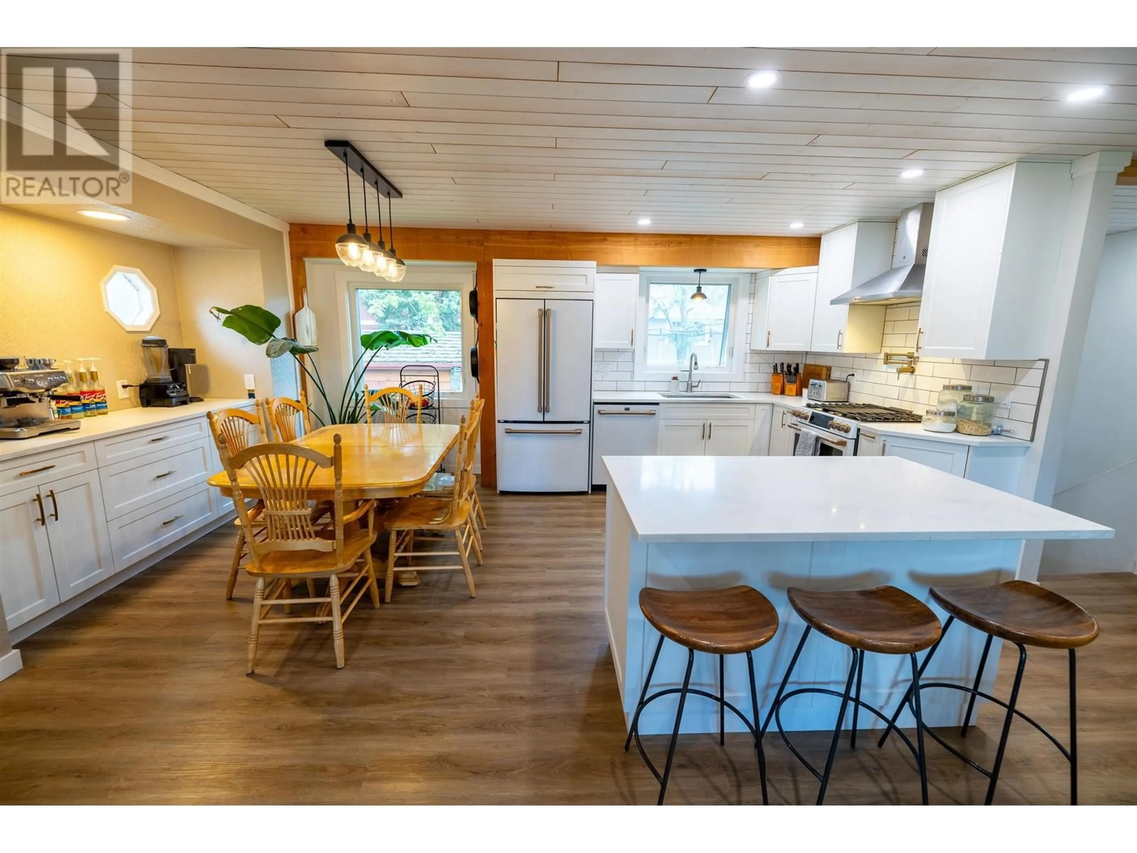 Open concept kitchen, wood/laminate floor for 7720 LANCASTER CRESCENT, Prince George British Columbia V2N3R5