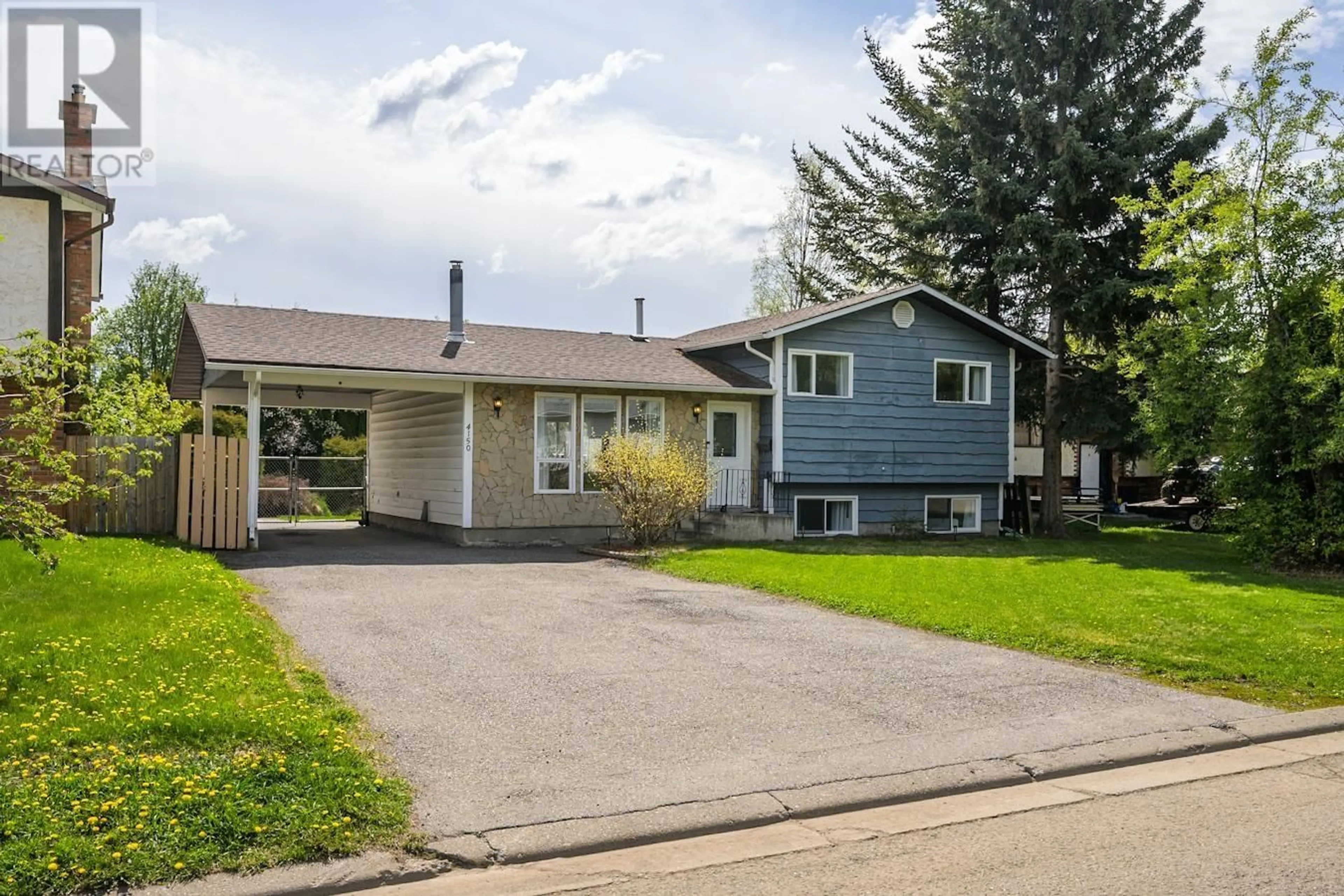 Home with vinyl exterior material, street for 4150 BAKER ROAD, Prince George British Columbia V2N5K6