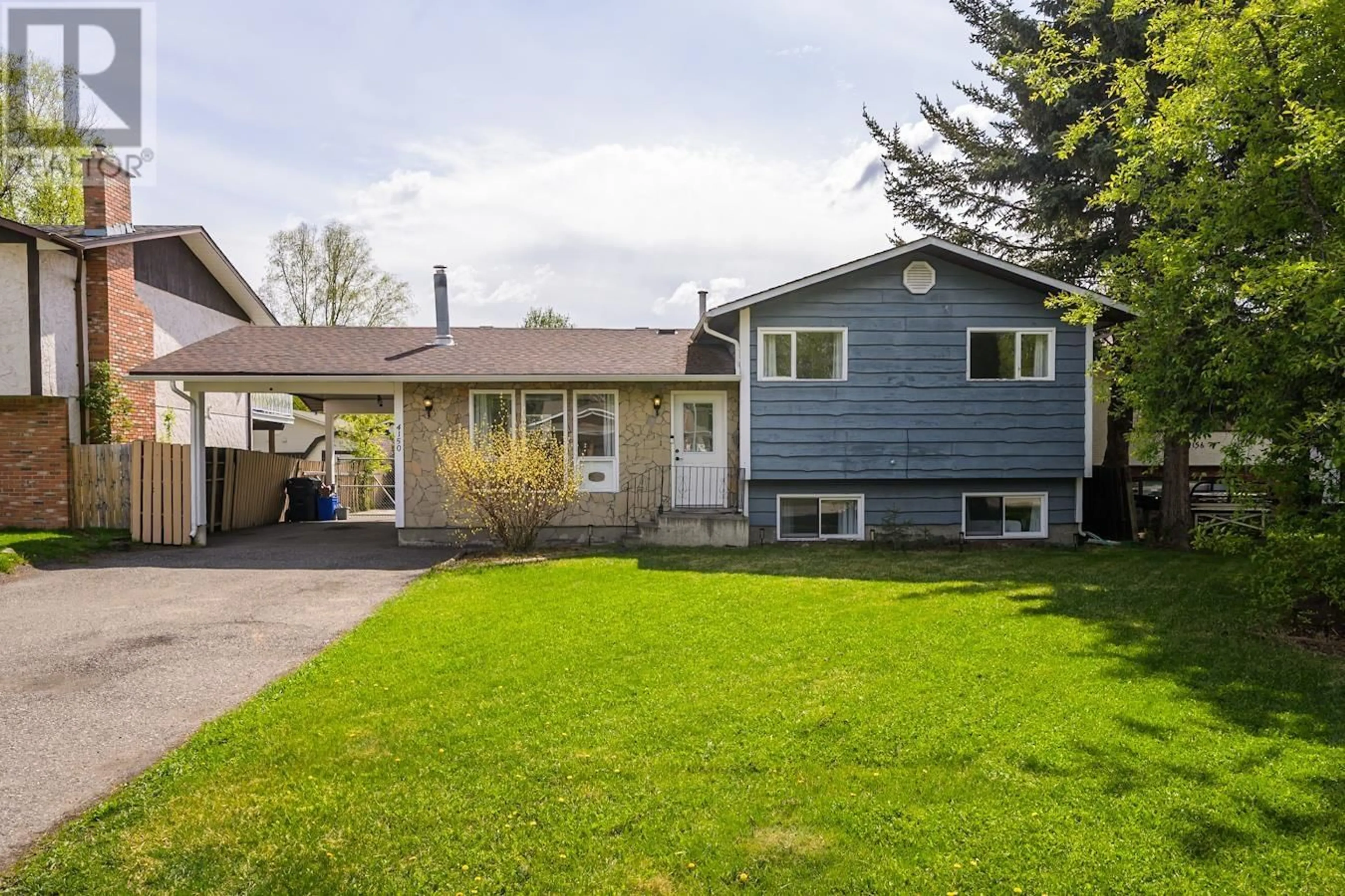 Home with vinyl exterior material, street for 4150 BAKER ROAD, Prince George British Columbia V2N5K6
