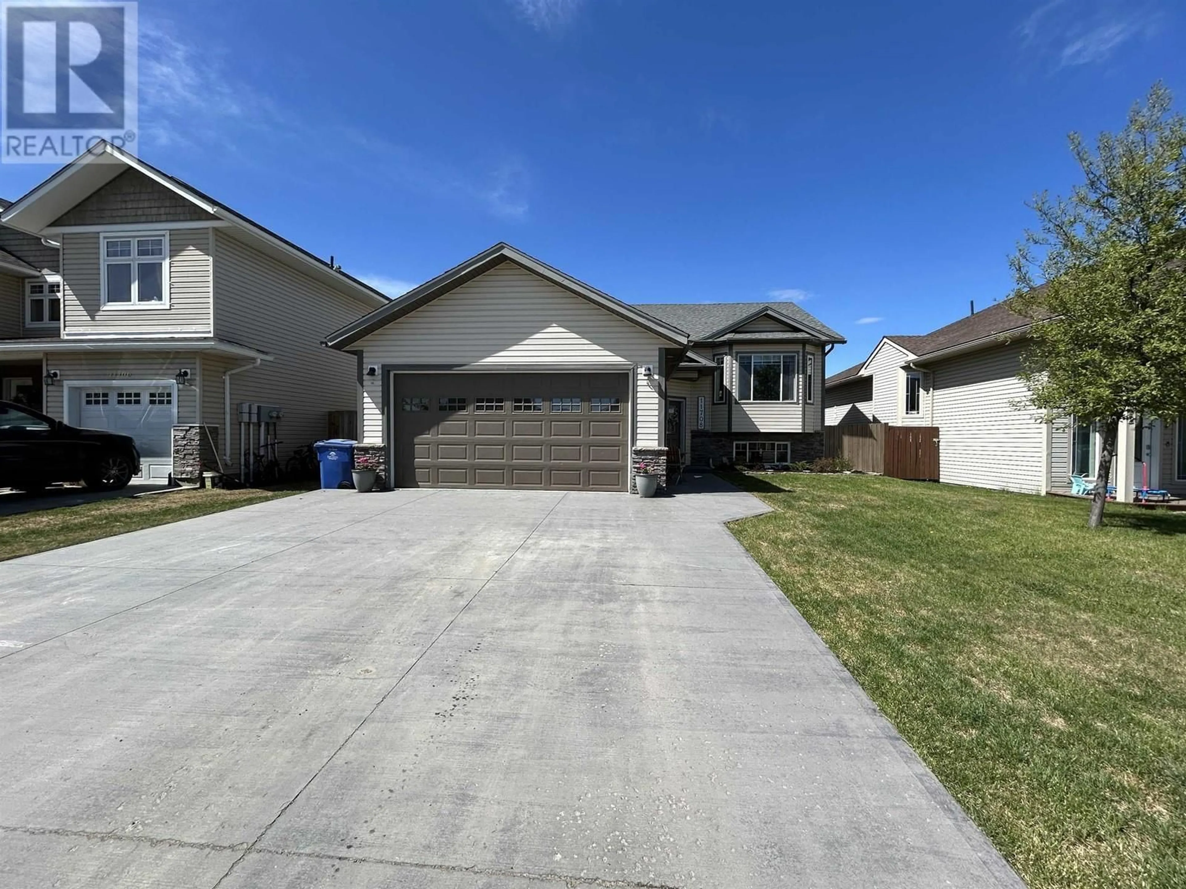 Home with vinyl exterior material, street for 11708 98A STREET, Fort St. John British Columbia V1J0E9