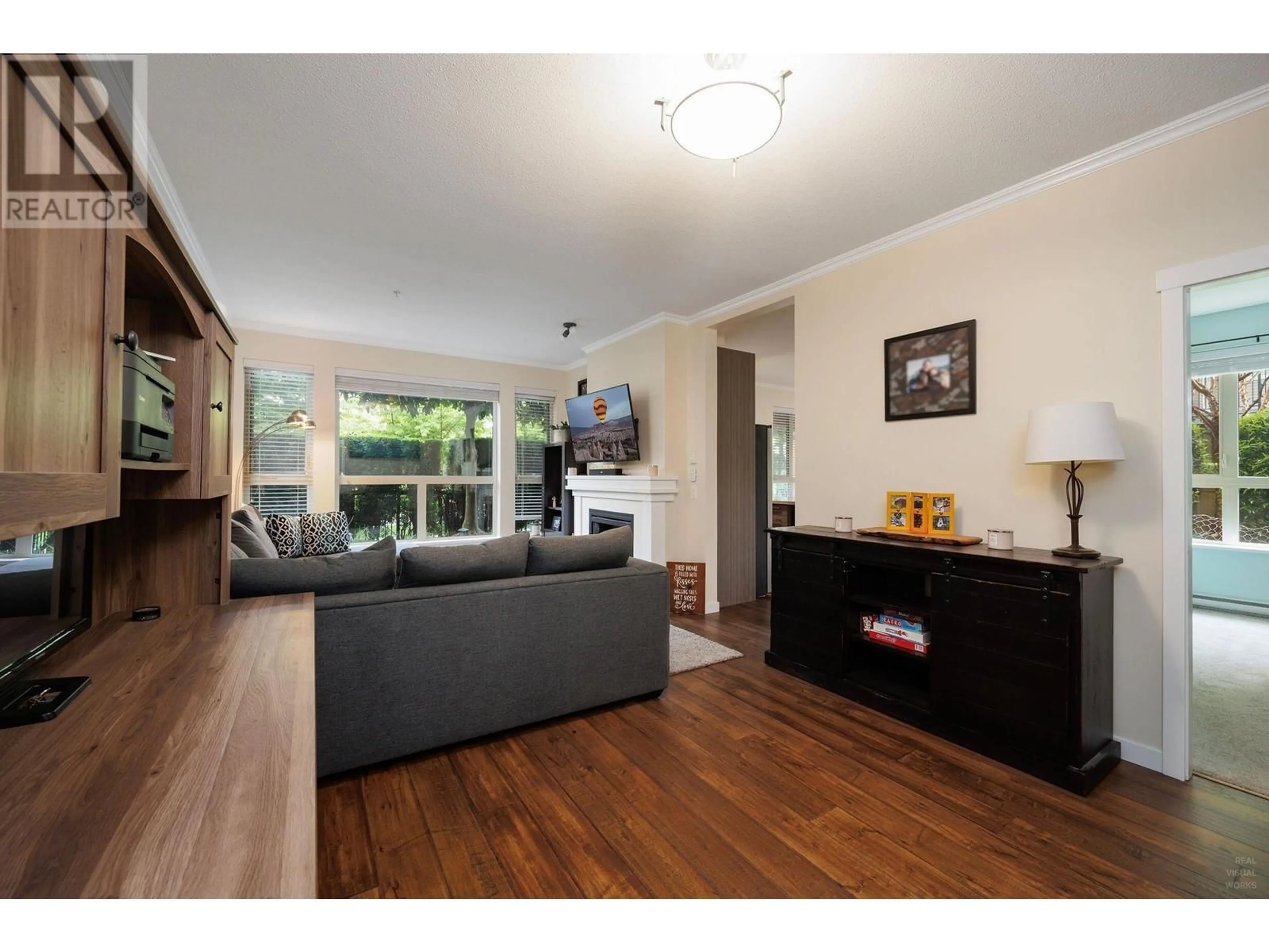 Living room with furniture, wood/laminate floor for 110 - 1150 KENSAL PLACE, Coquitlam British Columbia V3B0H4