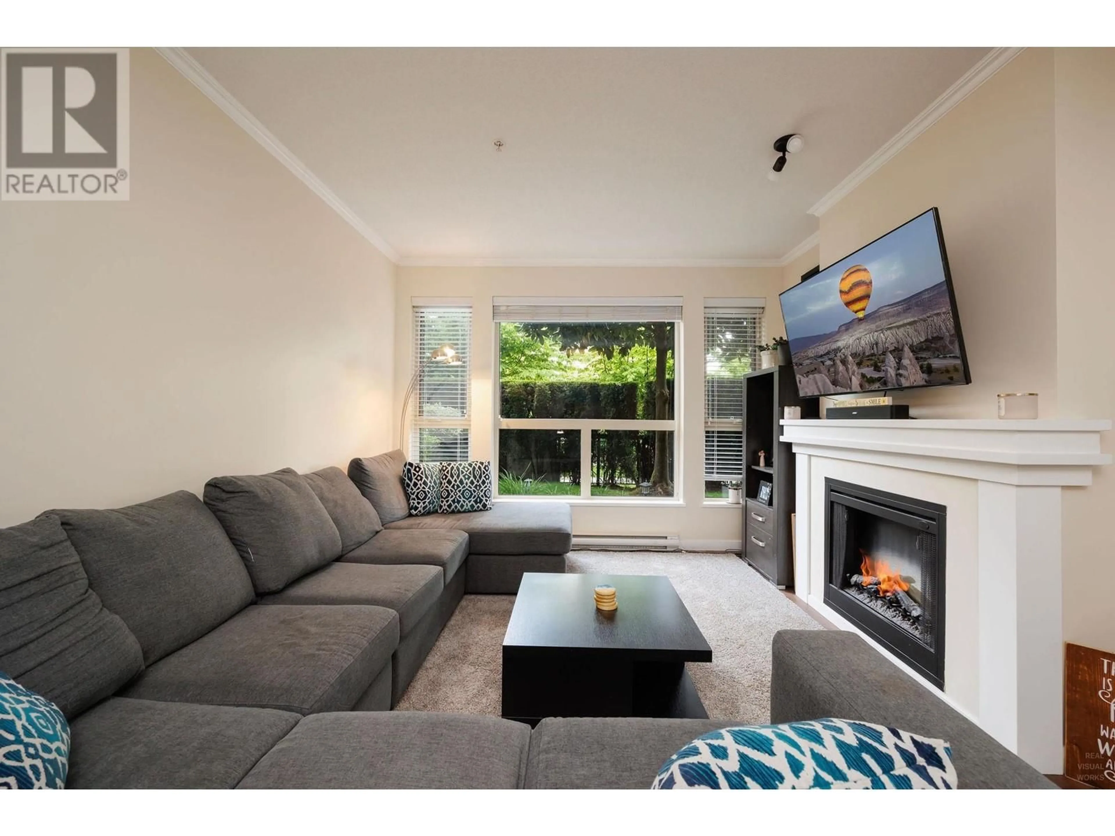 Living room with furniture, wood/laminate floor for 110 - 1150 KENSAL PLACE, Coquitlam British Columbia V3B0H4