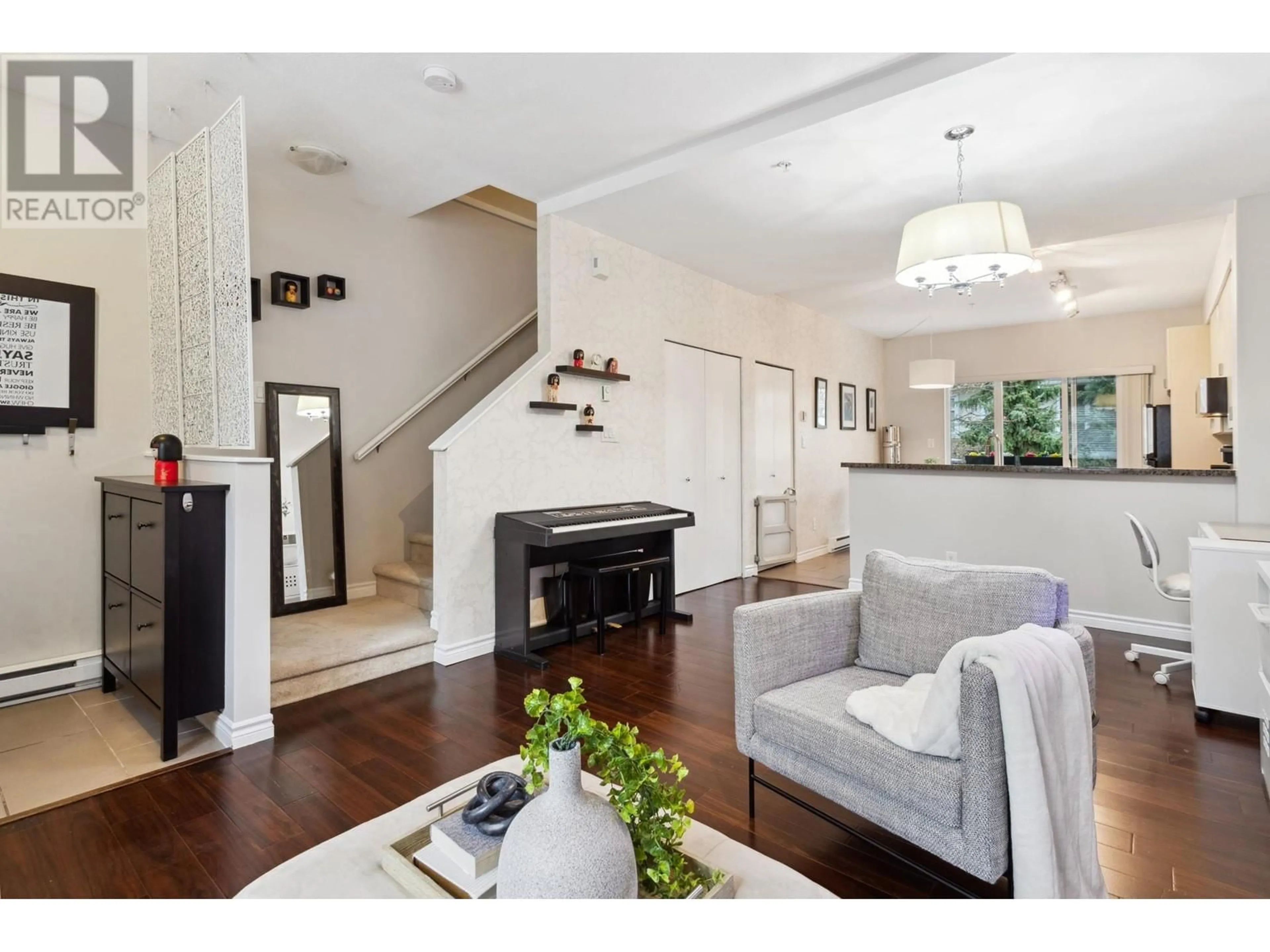 Living room with furniture, wood/laminate floor for 83 - 6878 SOUTHPOINT DRIVE, Burnaby British Columbia V3N5E4