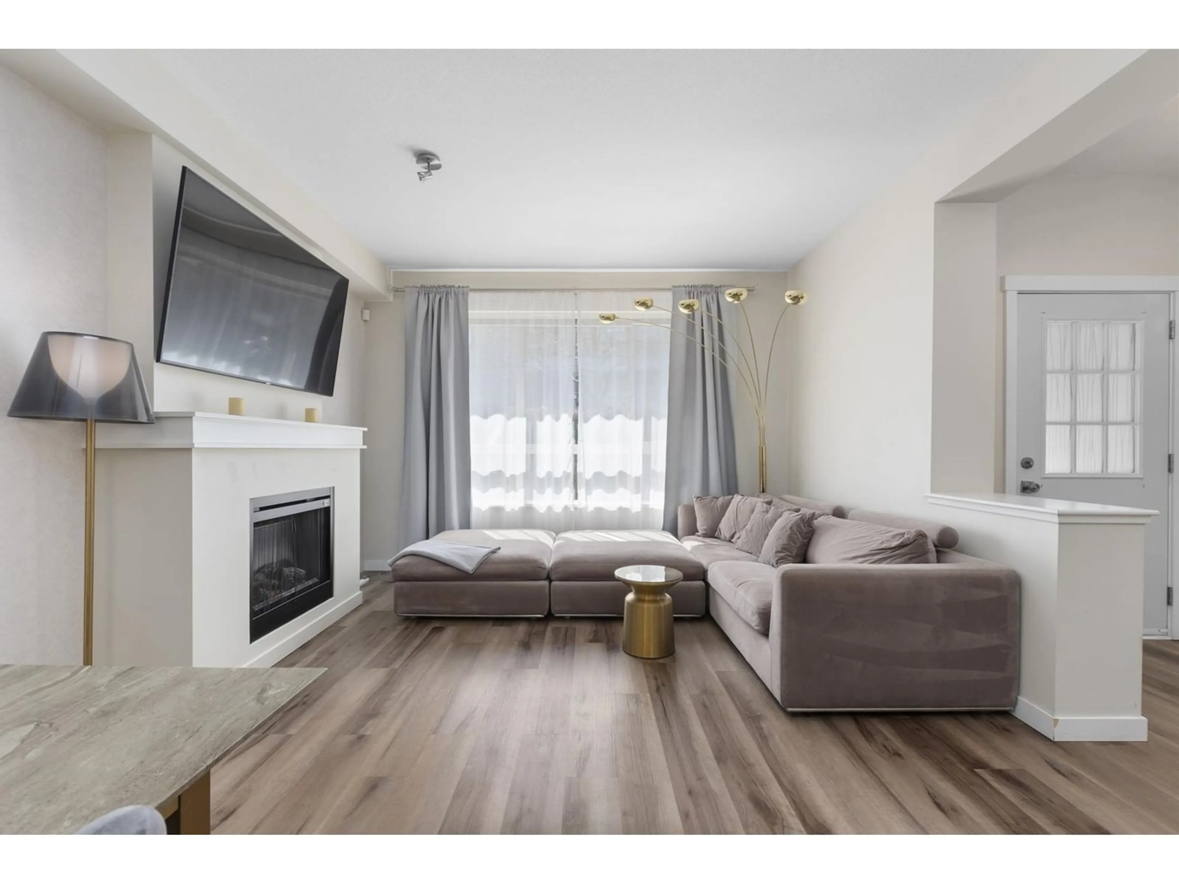 Living room with furniture, wood/laminate floor for 96 - 2738 158, Surrey British Columbia V3Z3K3