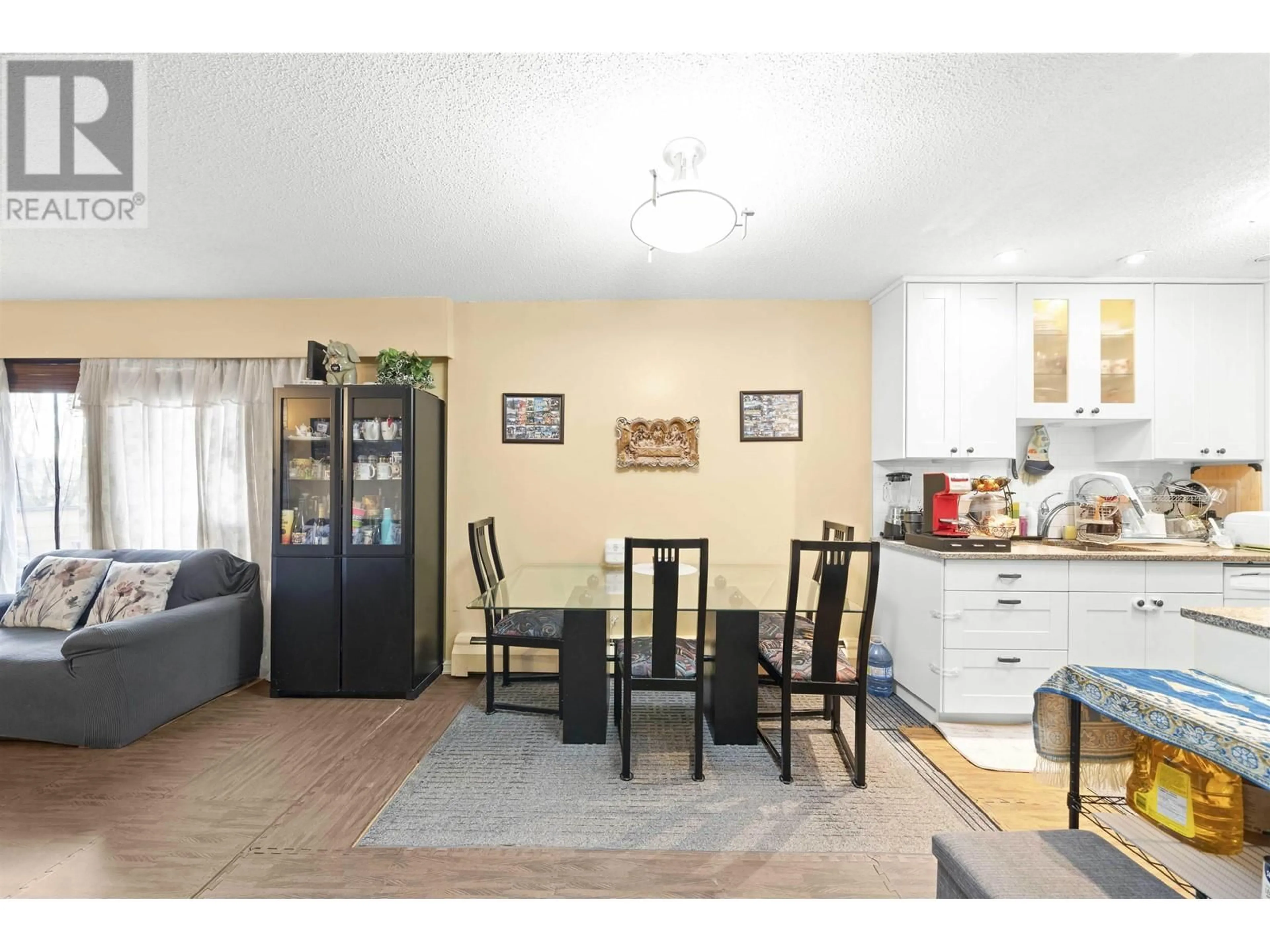 Open concept kitchen, wood/laminate floor for 312 - 2277 30TH AVENUE, Vancouver British Columbia V5N5N1