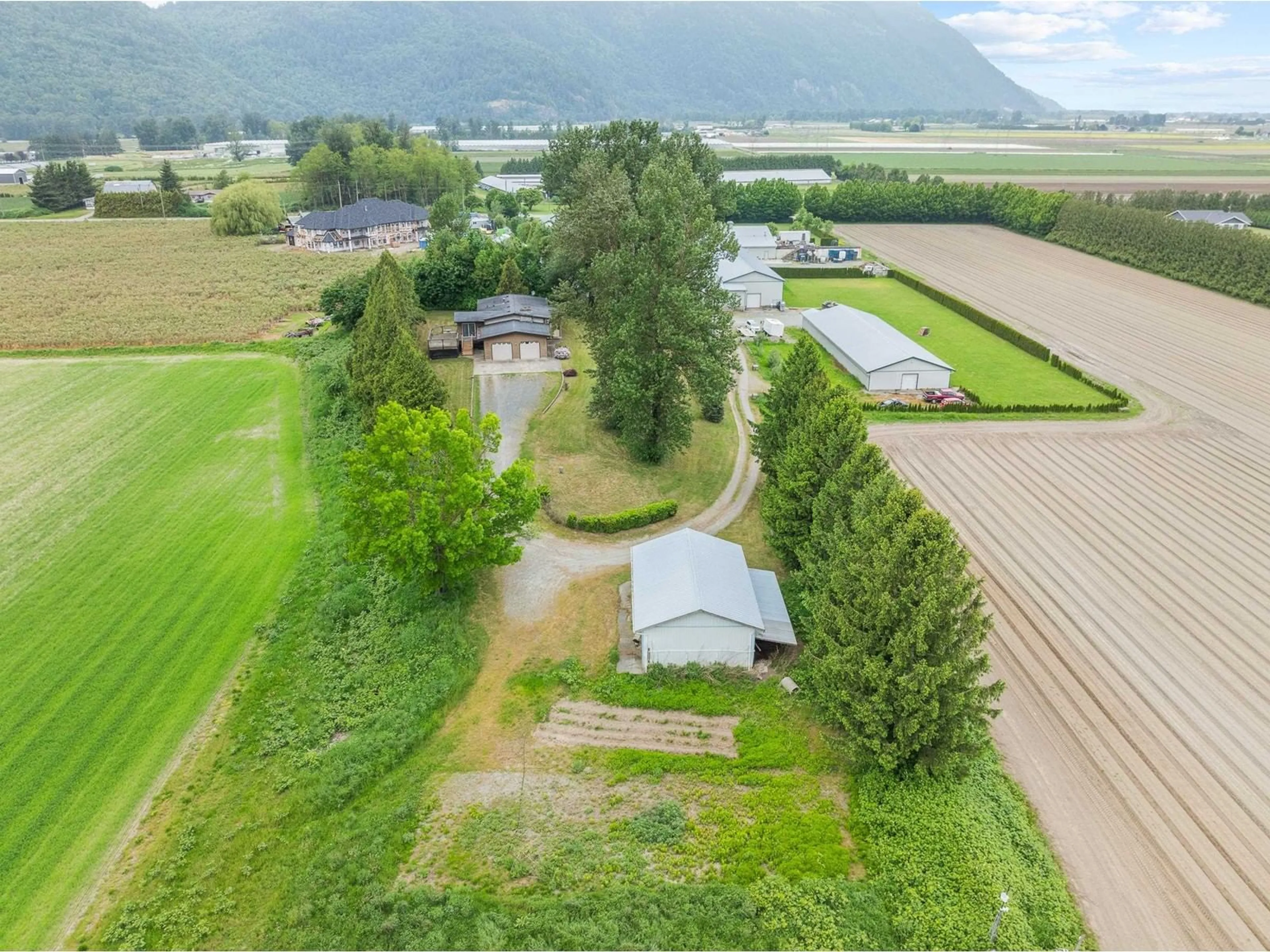 A pic from outside/outdoor area/front of a property/back of a property/a pic from drone, mountain view for 38604 NO 5, Abbotsford British Columbia V3G2G3