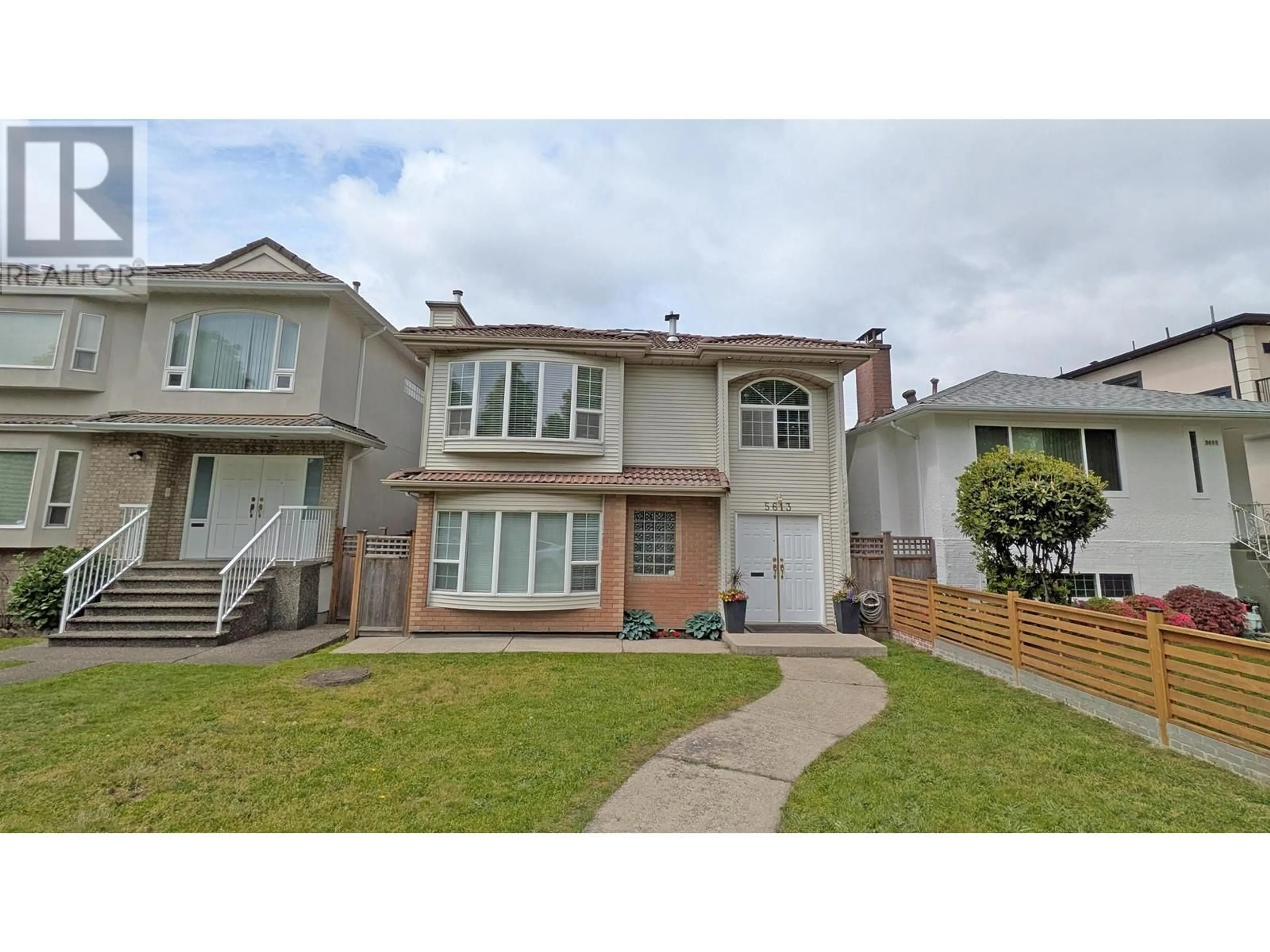 Home with vinyl exterior material, street for 5613 BRUCE STREET, Vancouver British Columbia V5P3M5