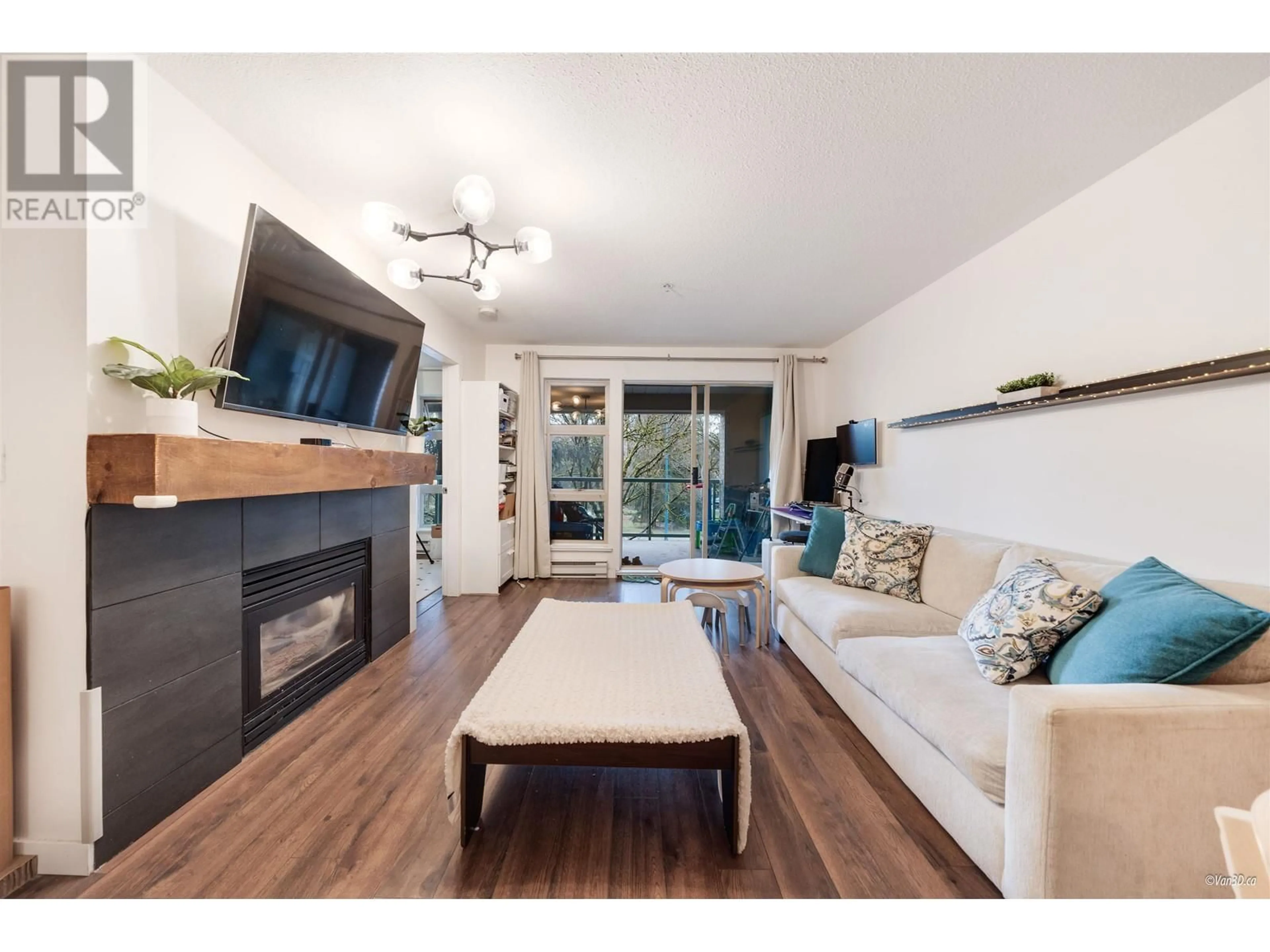 Living room with furniture, wood/laminate floor for 205 - 301 MAUDE ROAD, Port Moody British Columbia V3H5B1