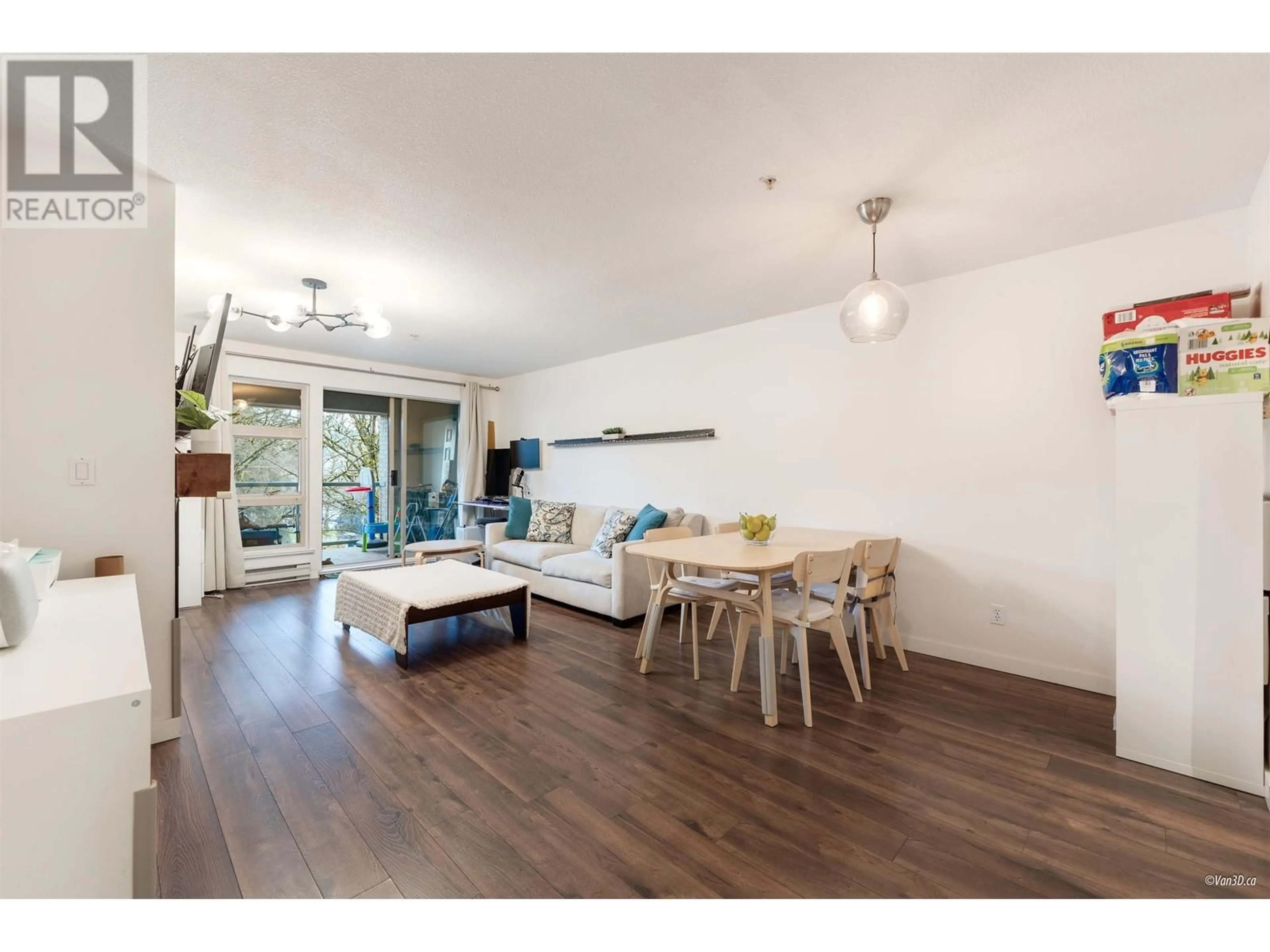 Living room with furniture, wood/laminate floor for 205 - 301 MAUDE ROAD, Port Moody British Columbia V3H5B1