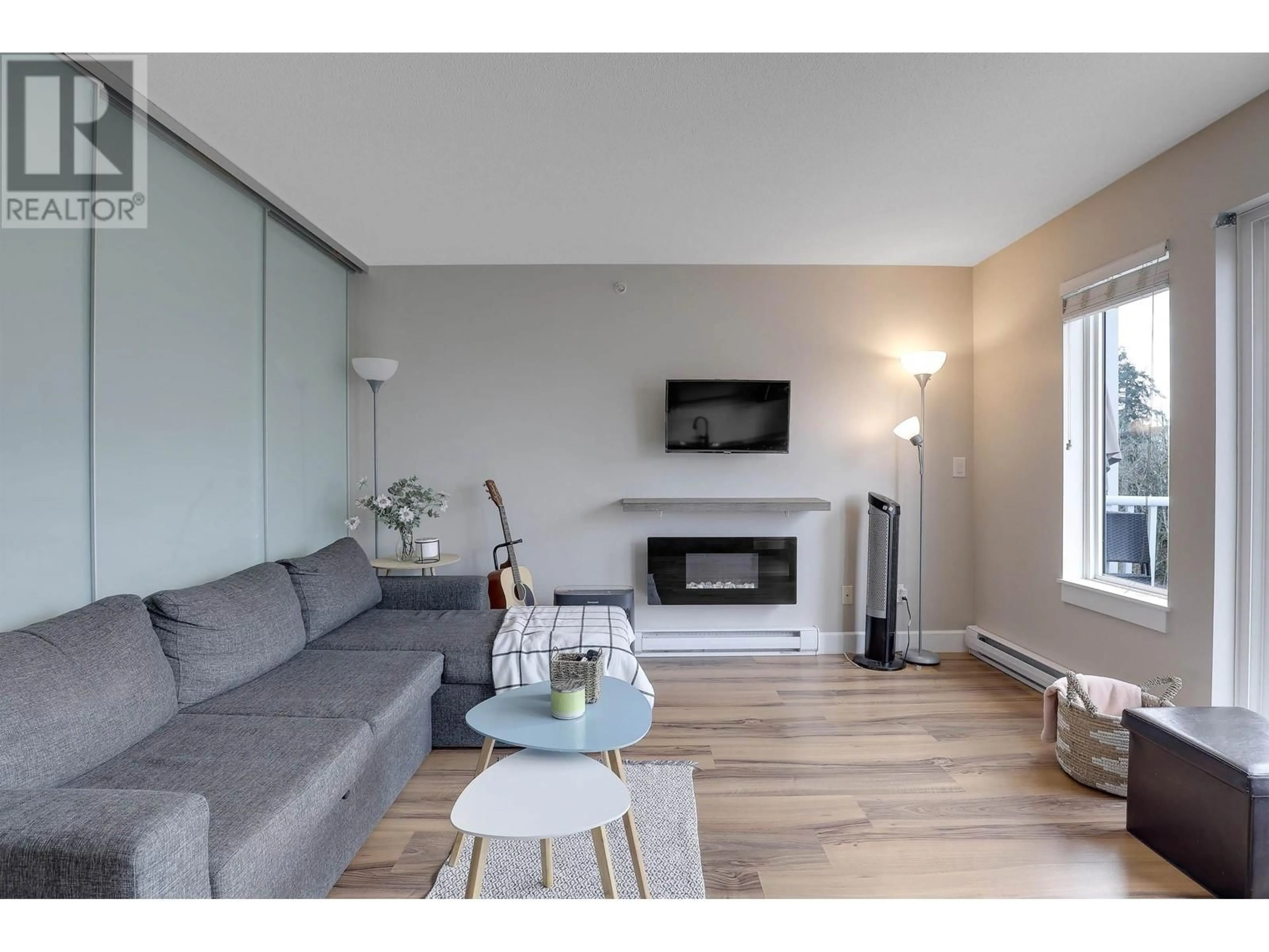 Living room with furniture, wood/laminate floor for 408 - 12283 224TH STREET, Maple Ridge British Columbia V2X8Z3