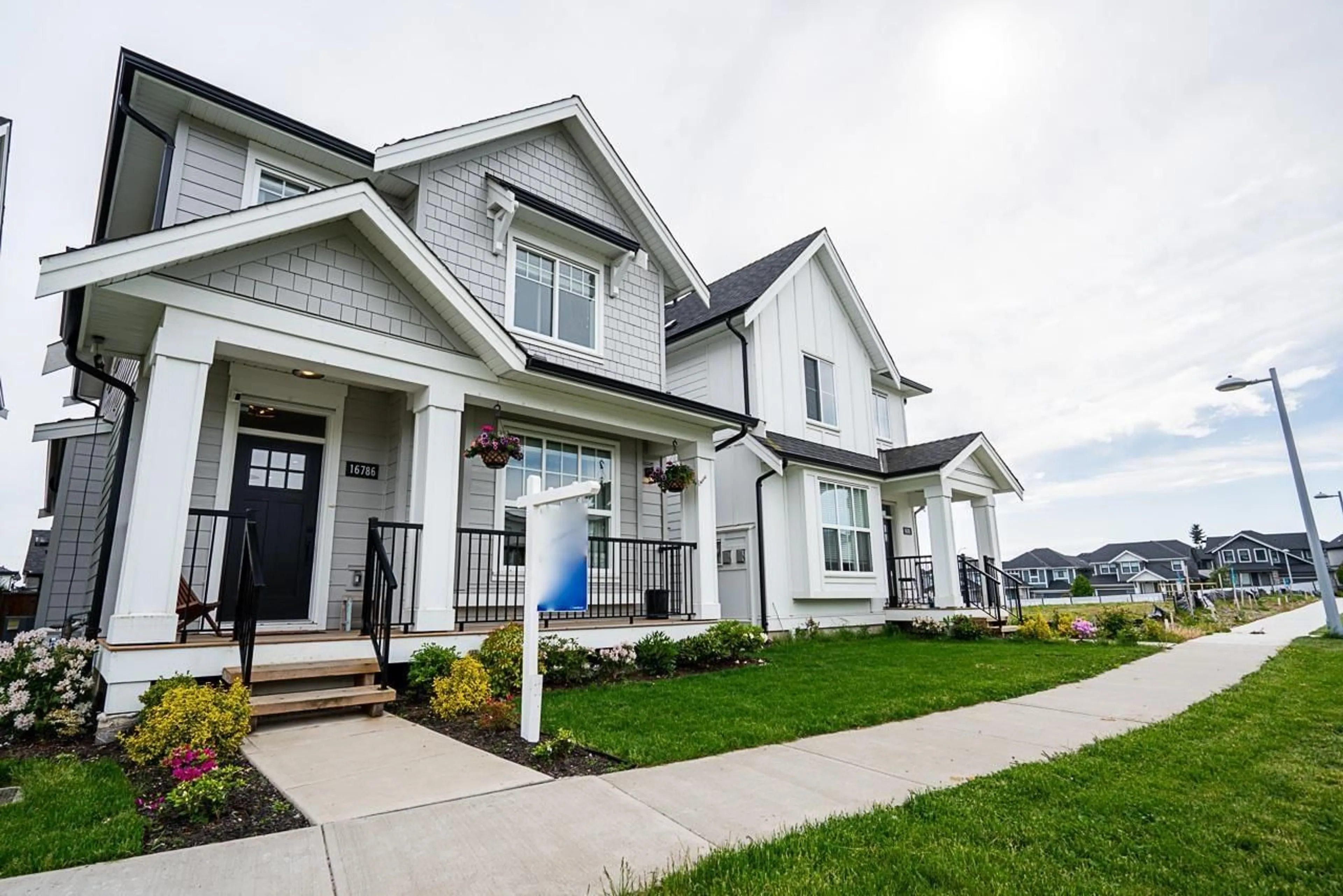 Home with vinyl exterior material, street for 16786 21A, Surrey British Columbia V3Z0M3