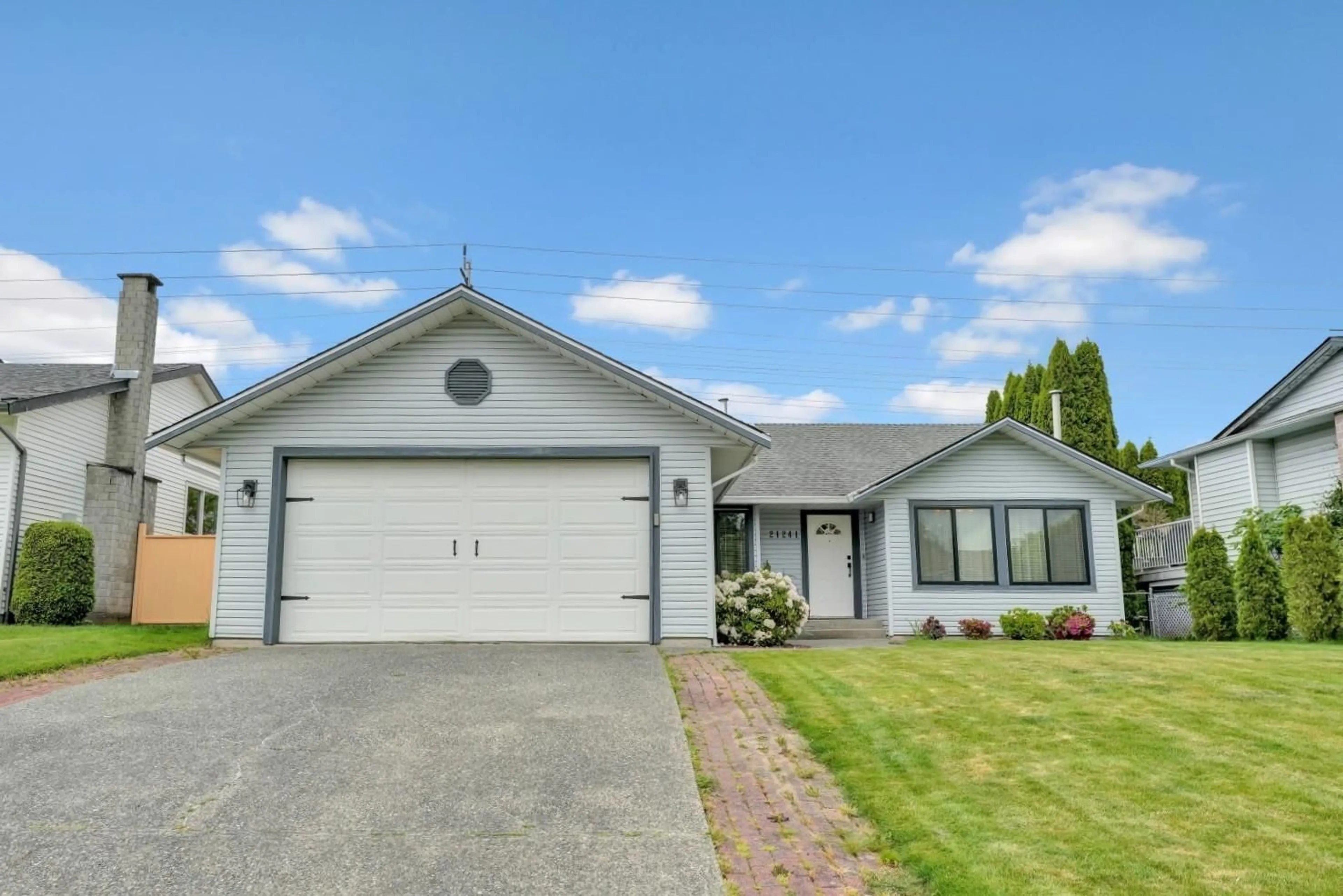 Home with vinyl exterior material, street for 21241 95, Langley British Columbia V1M1M9