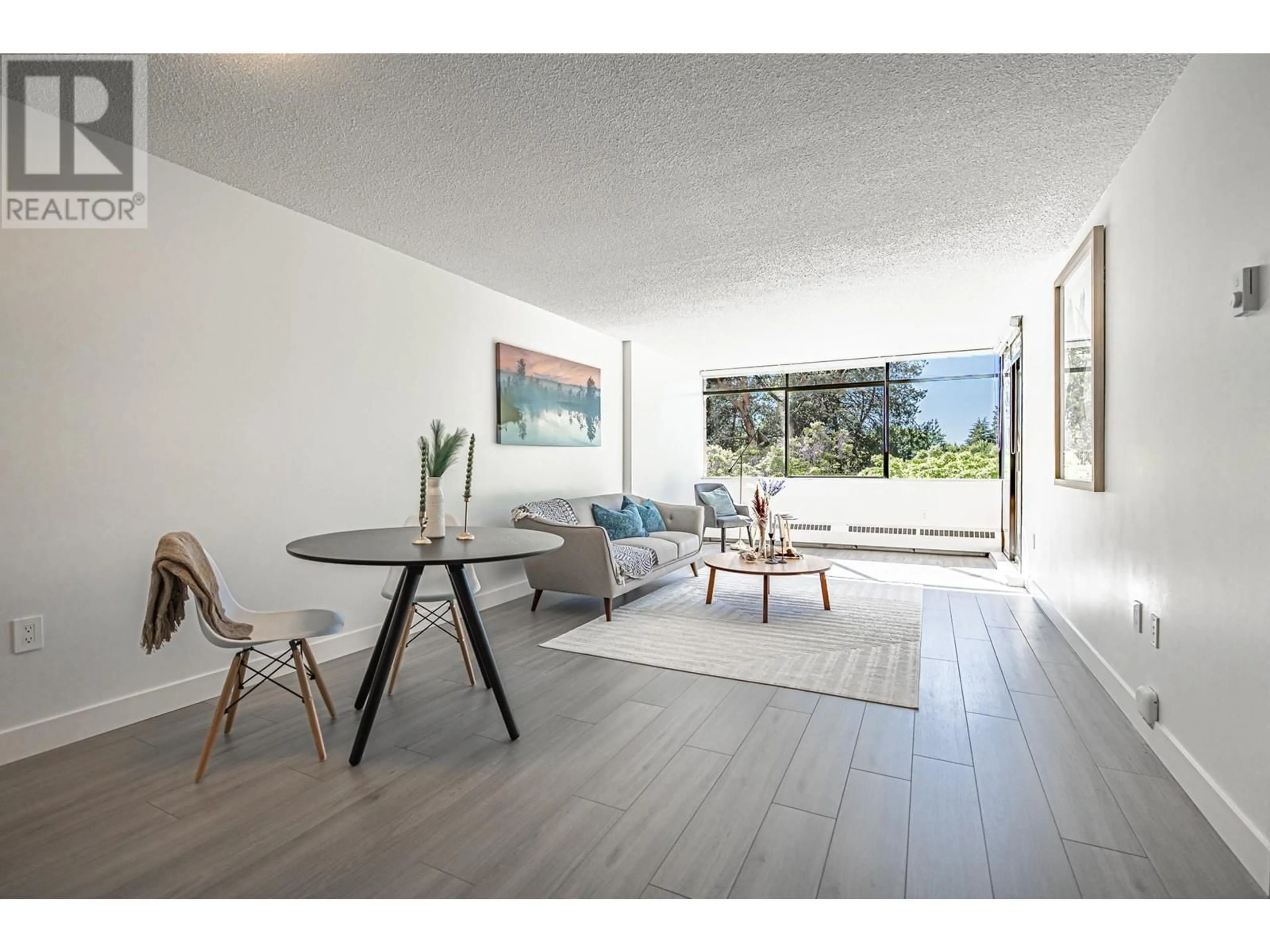 Living room with furniture, wood/laminate floor for 407 - 6611 MINORU BOULEVARD, Richmond British Columbia V6Y1Y9