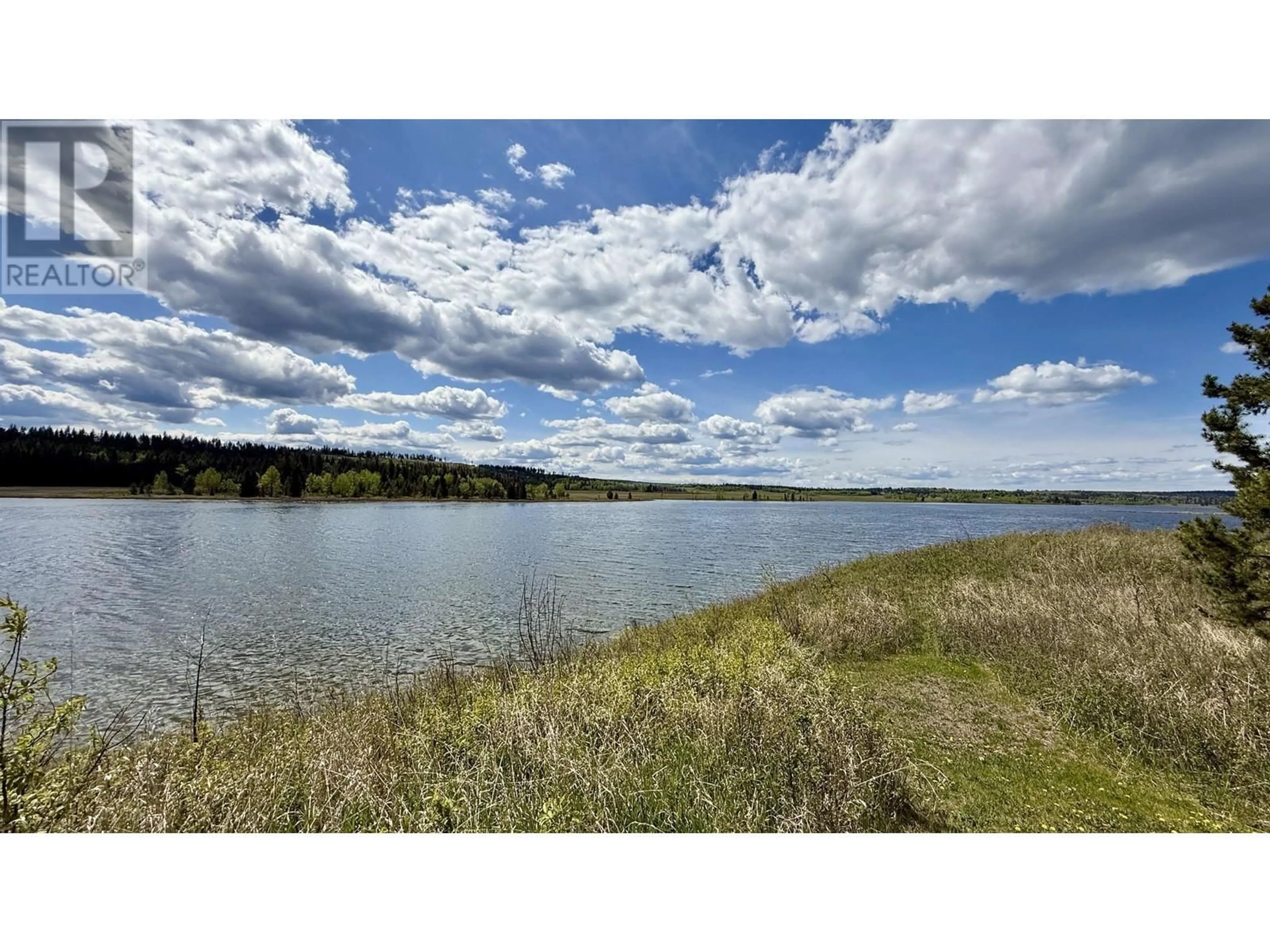 A pic from outside/outdoor area/front of a property/back of a property/a pic from drone, water/lake/river/ocean view for 5460 CARLSON ROAD, 100 Mile House British Columbia V0K2E1