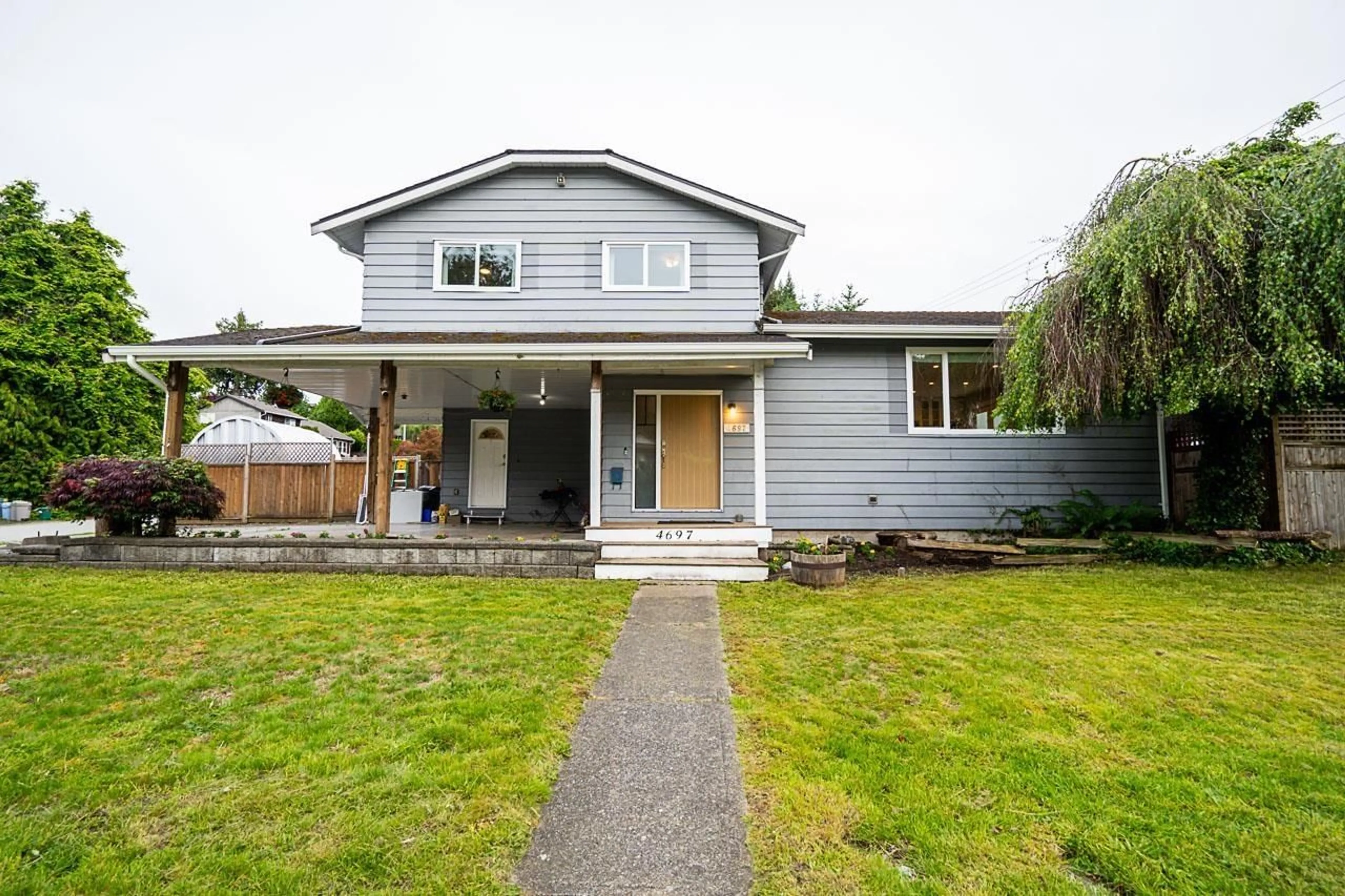 Home with vinyl exterior material, street for 4697 208A, Langley British Columbia V3A7E5