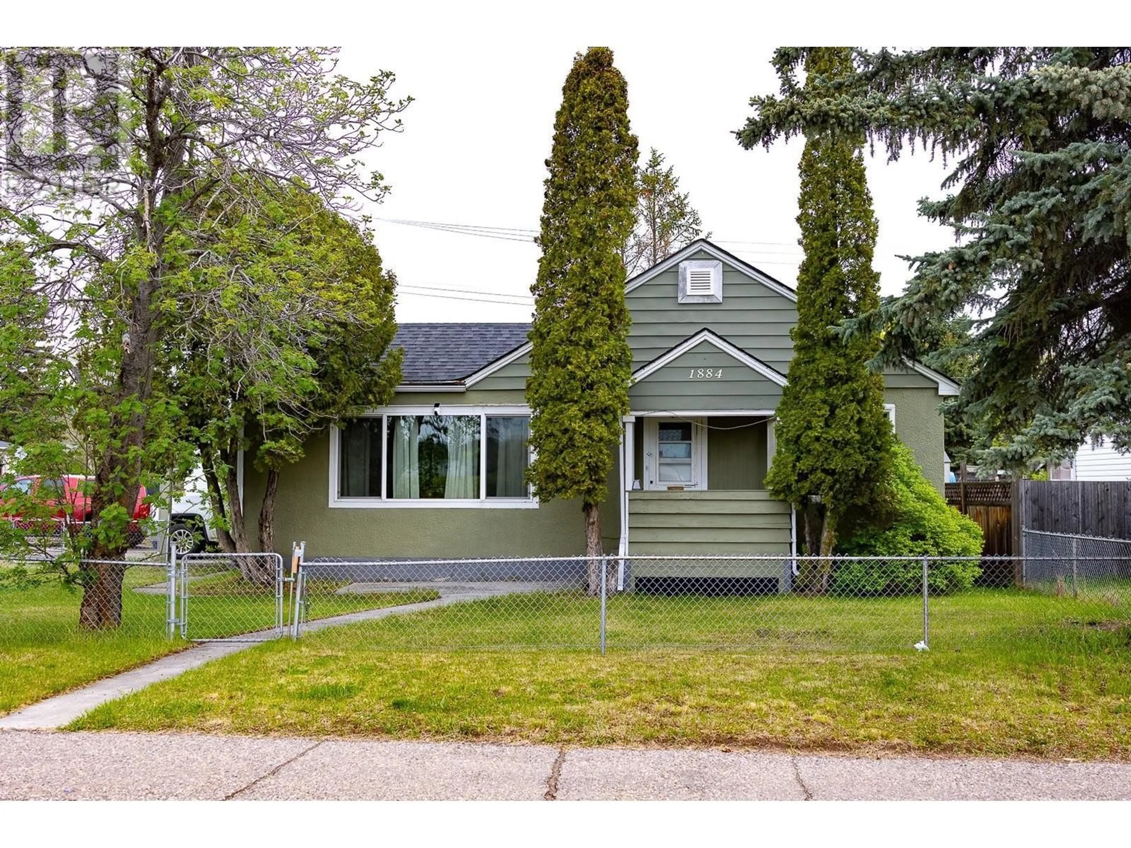 Home with vinyl exterior material, street for 1884 6TH AVENUE, Prince George British Columbia V2M1L6