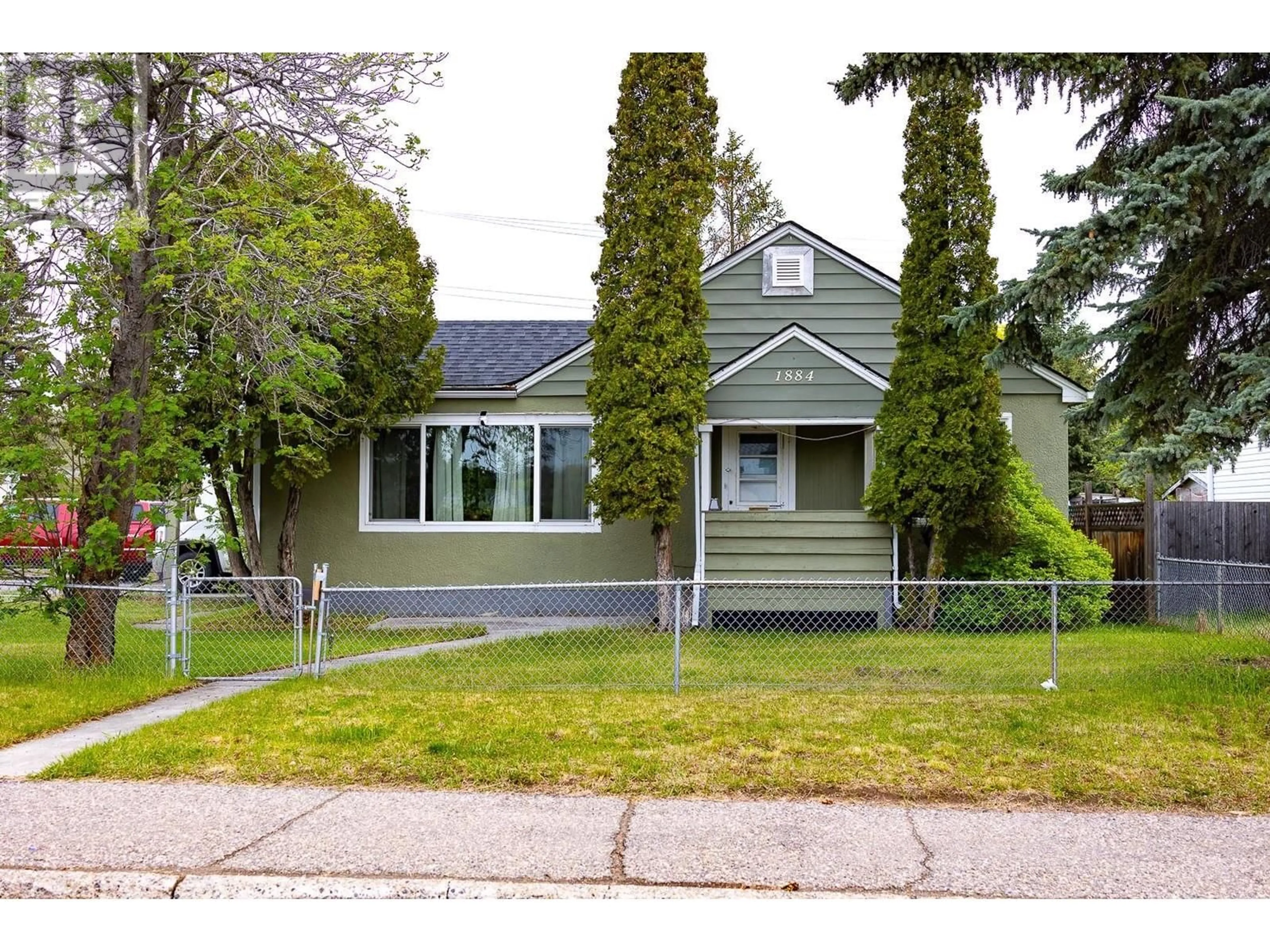 Home with vinyl exterior material, street for 1884 6TH AVENUE, Prince George British Columbia V2M1L6