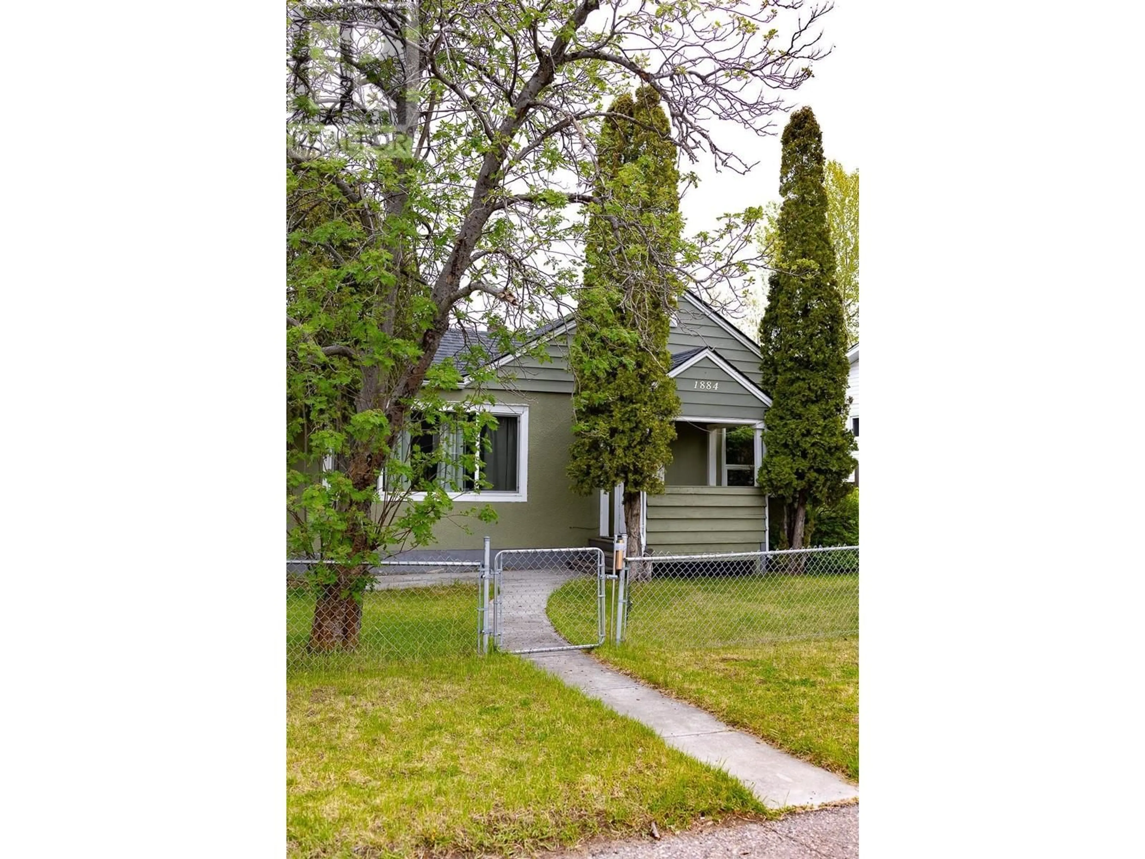 Home with vinyl exterior material, street for 1884 6TH AVENUE, Prince George British Columbia V2M1L6