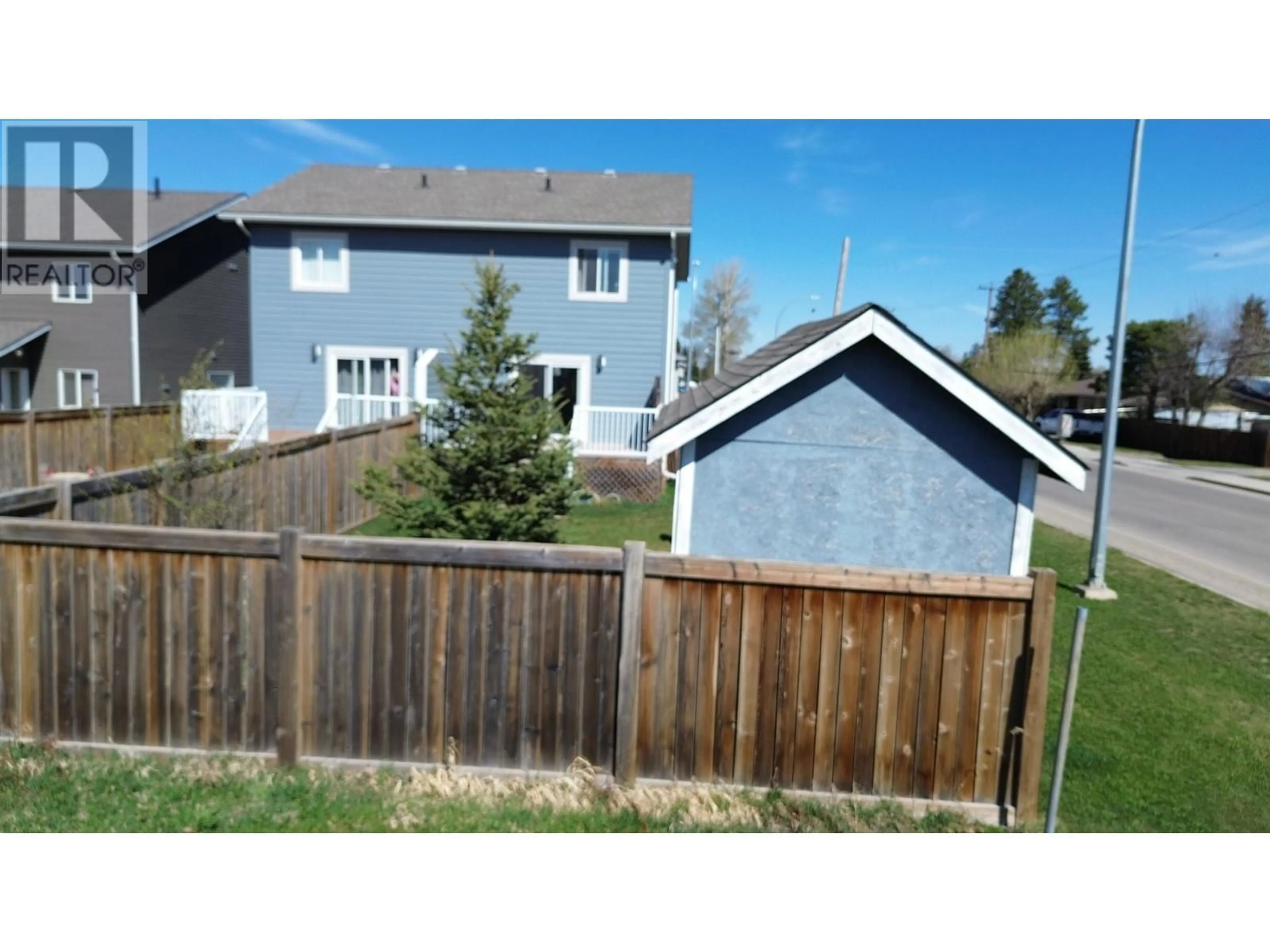 A pic from outside/outdoor area/front of a property/back of a property/a pic from drone, street for 9203 102 AVENUE, Fort St. John British Columbia V1J0J9