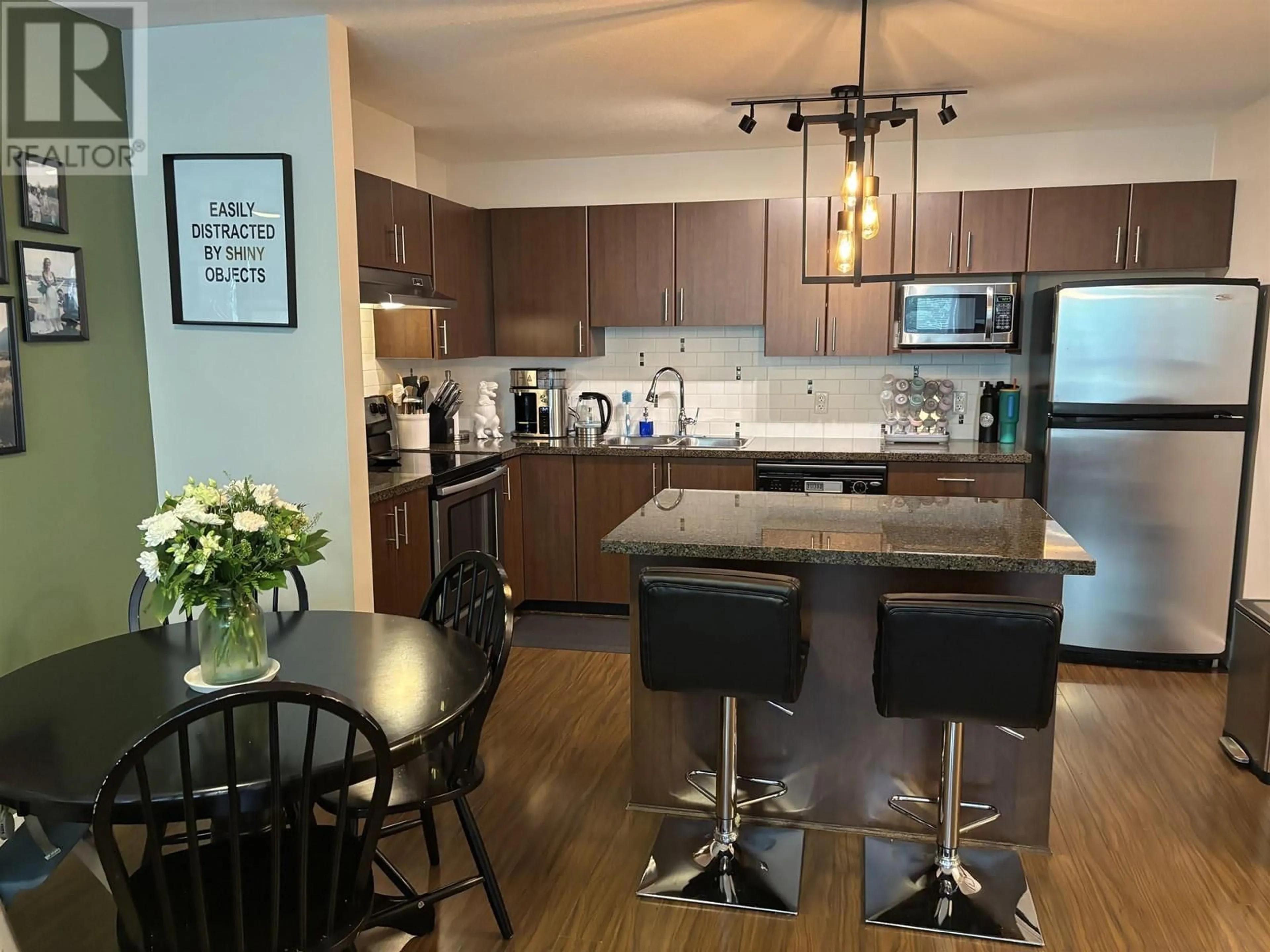 Open concept kitchen, wood/laminate floor for 404 - 12075 228 STREET, Maple Ridge British Columbia V2X6M2