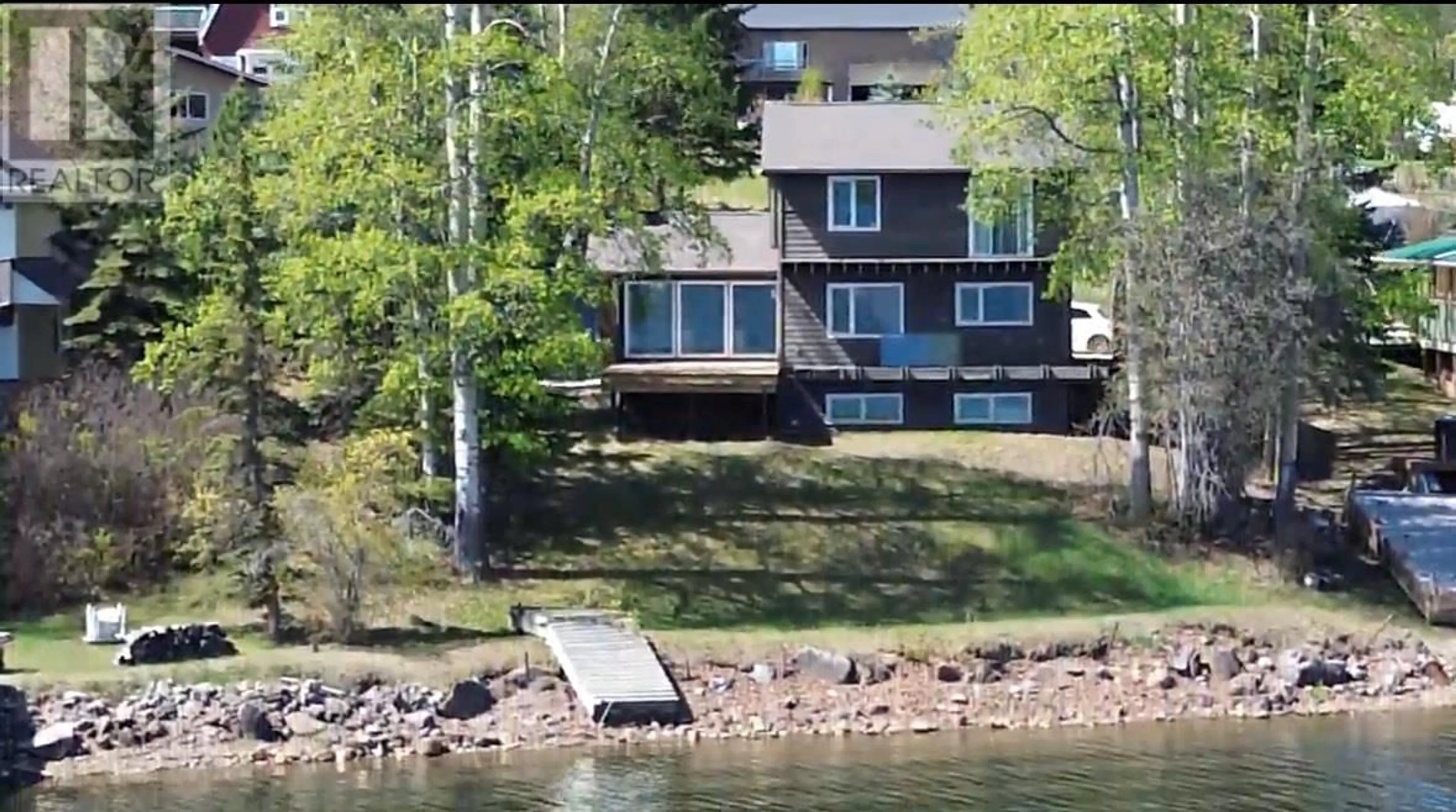 A pic from outside/outdoor area/front of a property/back of a property/a pic from drone, water/lake/river/ocean view for 13266 LAKESHORE DRIVE, Charlie Lake British Columbia V0C1H0