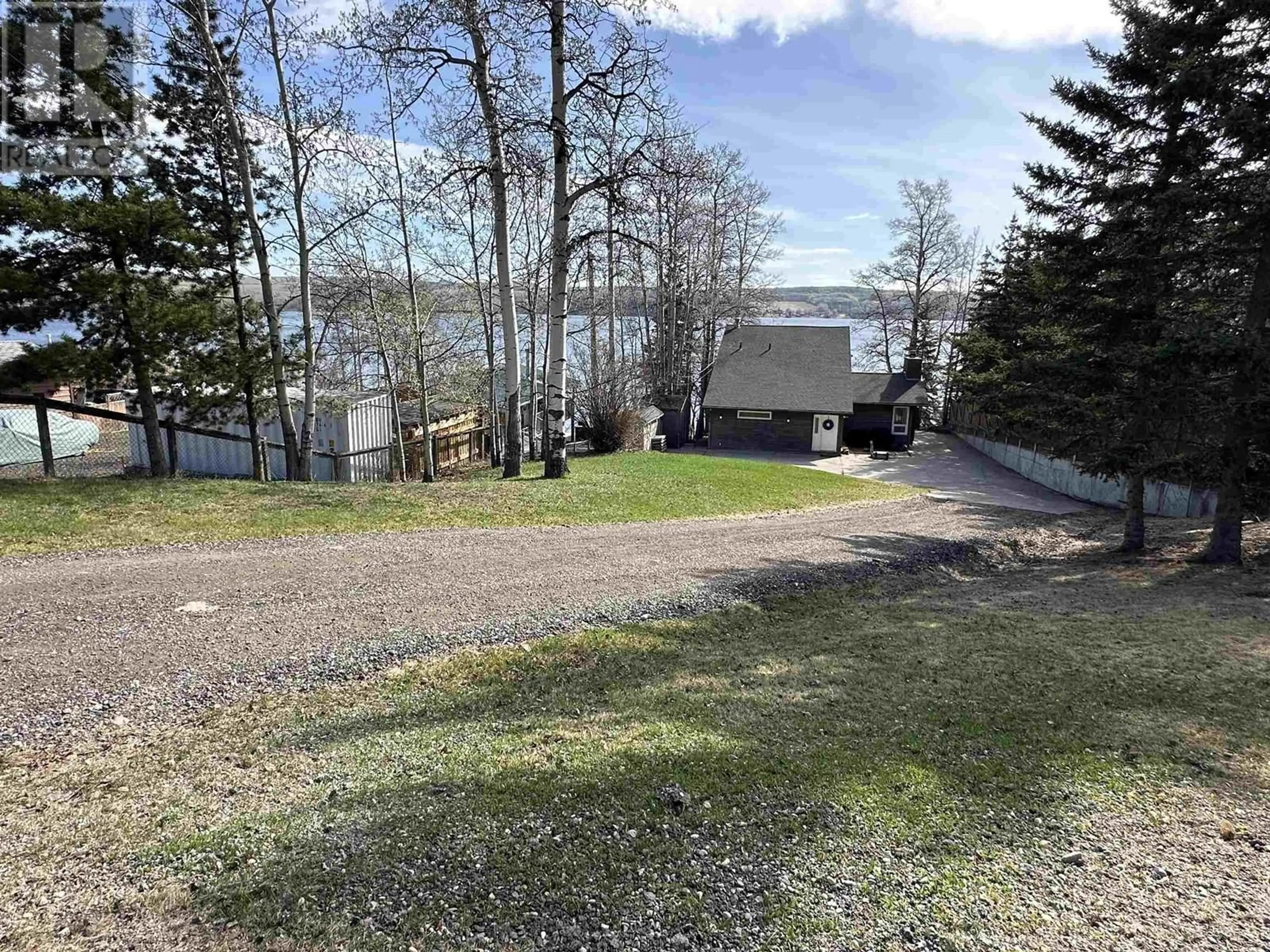 A pic from outside/outdoor area/front of a property/back of a property/a pic from drone, water/lake/river/ocean view for 13266 LAKESHORE DRIVE, Charlie Lake British Columbia V0C1H0