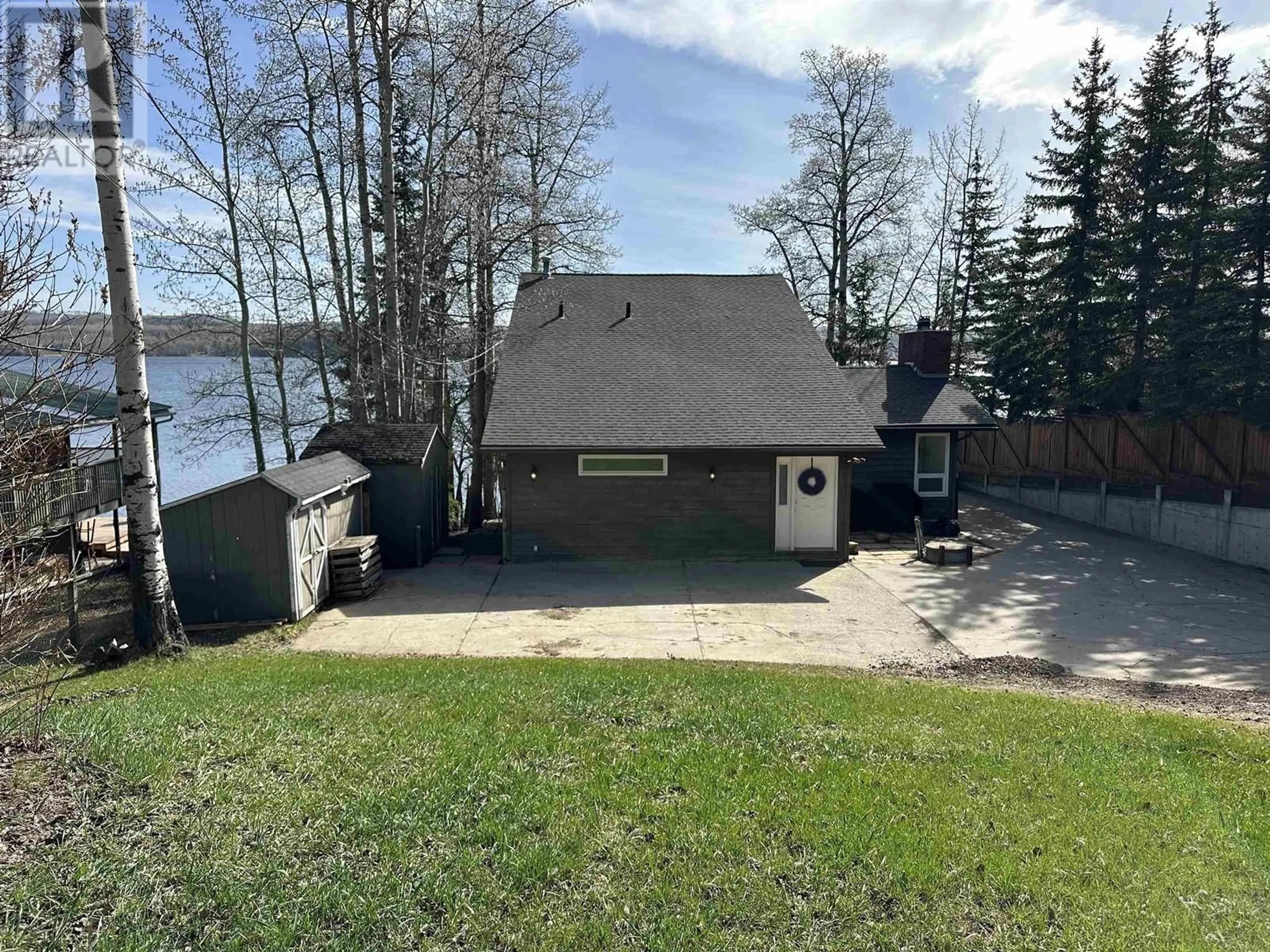 A pic from outside/outdoor area/front of a property/back of a property/a pic from drone, water/lake/river/ocean view for 13266 LAKESHORE DRIVE, Charlie Lake British Columbia V0C1H0