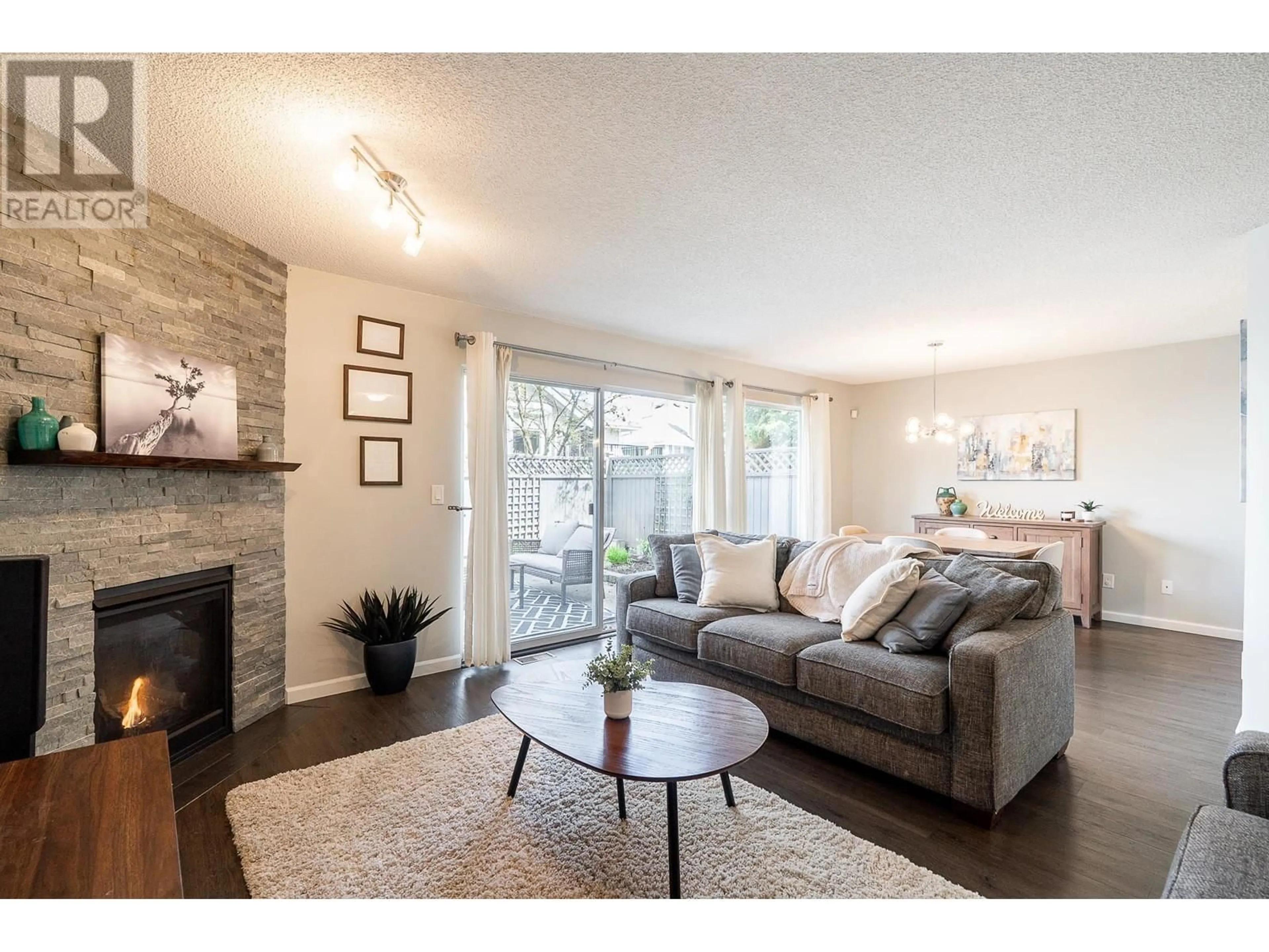 Living room with furniture, wood/laminate floor for 18 - 2561 RUNNEL DRIVE, Coquitlam British Columbia V3E2S3
